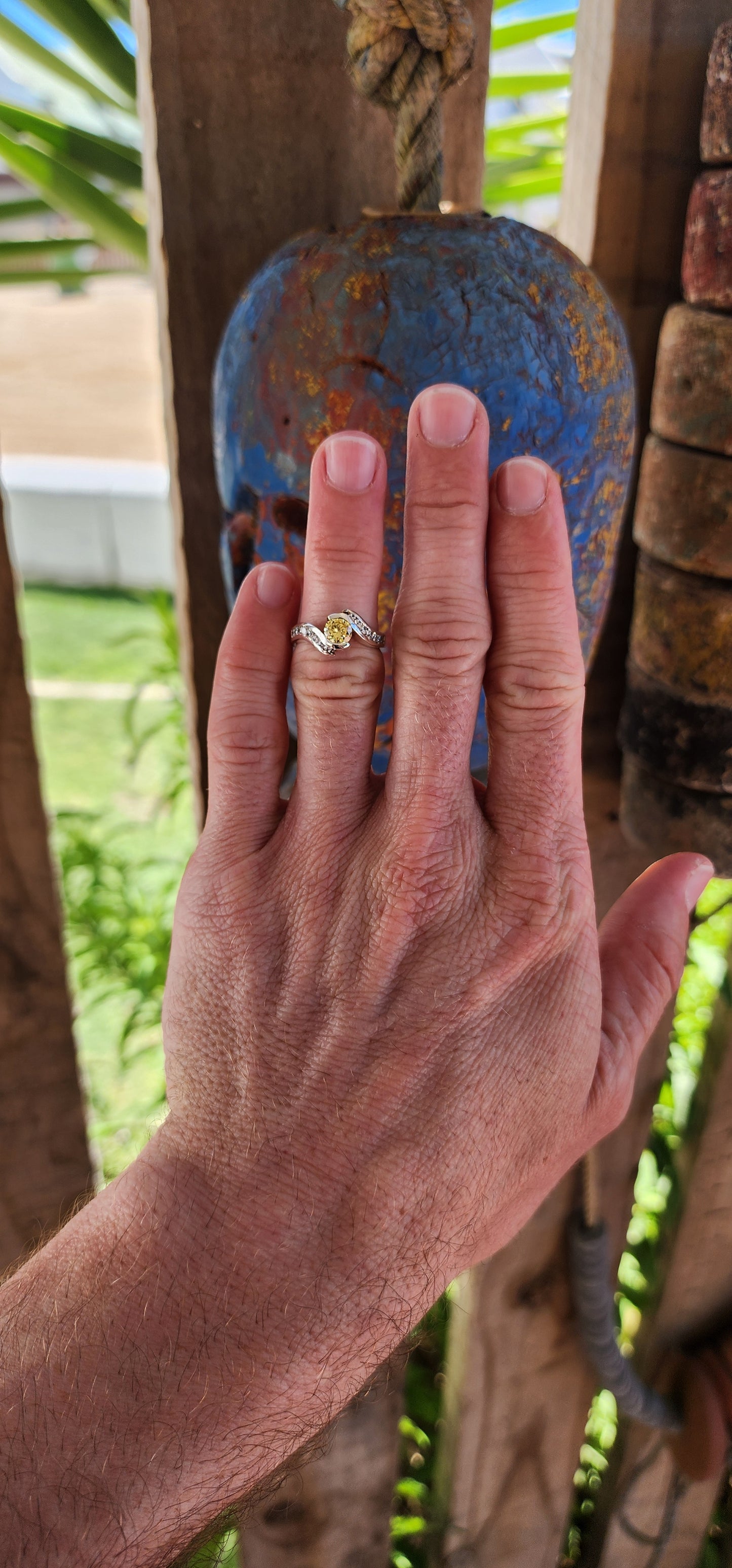 This breathtaking handmade sterling silver ring is a true work of art, seamlessly blending contemporary elegance with timeless beauty. The fluid, sculptural crossover design of the band exudes modernity while maintaining an air of classic refinement.
