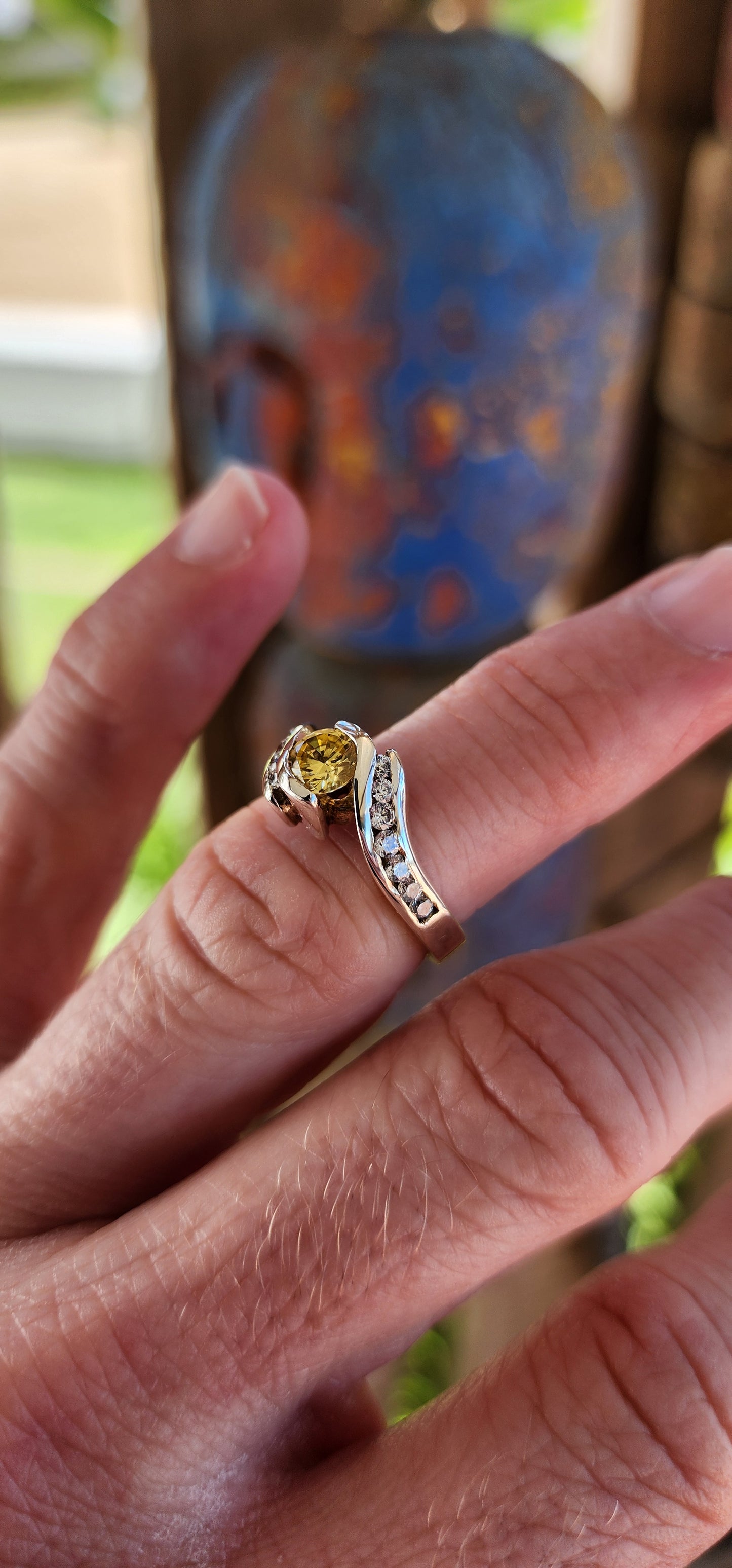 This breathtaking handmade sterling silver ring is a true work of art, seamlessly blending contemporary elegance with timeless beauty. The fluid, sculptural crossover design of the band exudes modernity while maintaining an air of classic refinement.