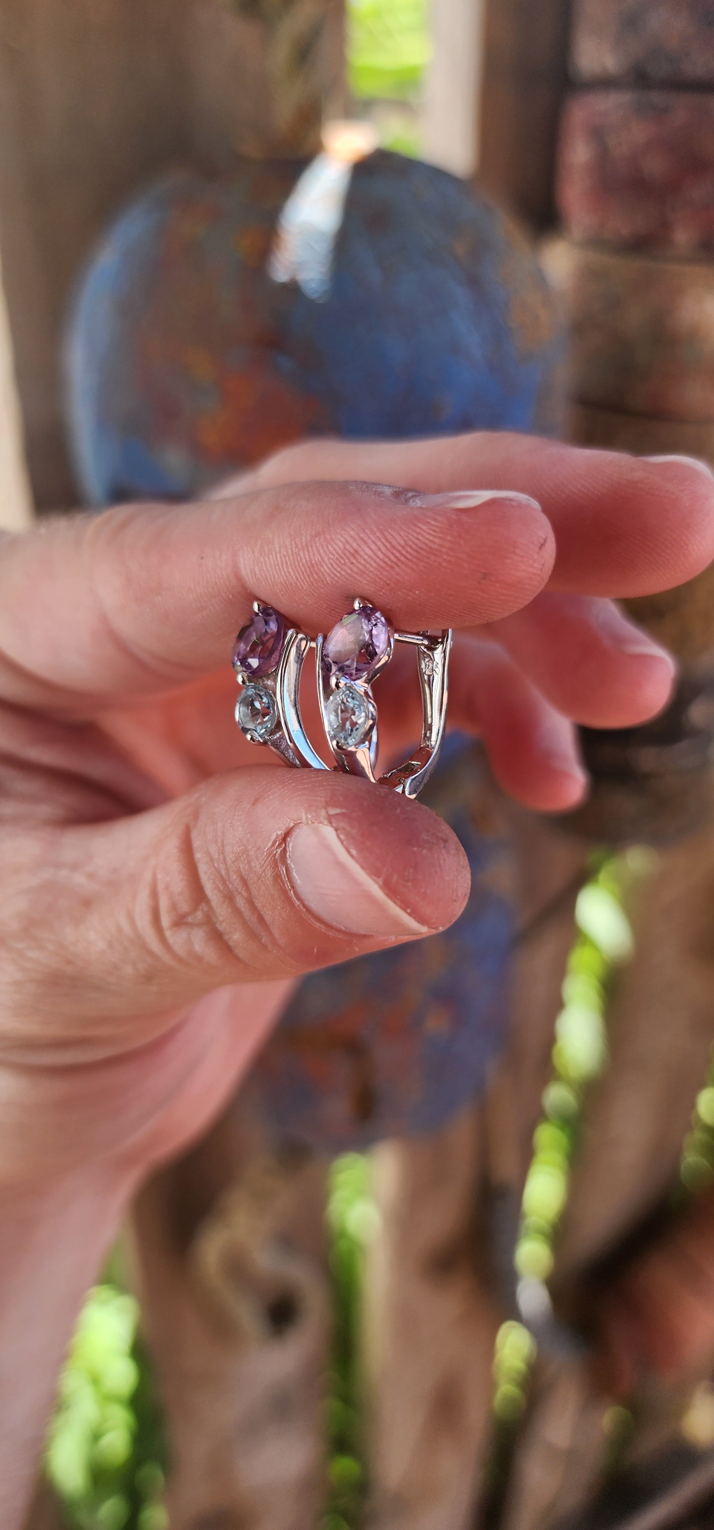 Like a stardust-kissed evening sky, these sterling silver huggie style earrings blend the mystical charm of twilight hues with the elegance of timeless craftsmanship.