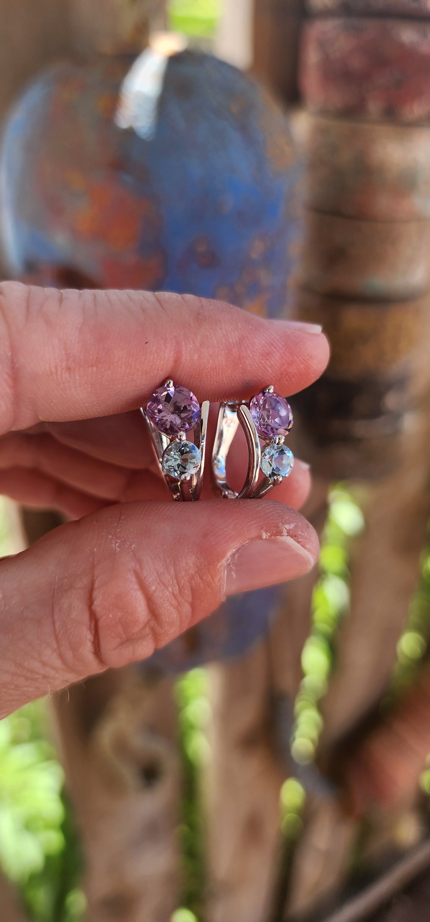 Like a stardust-kissed evening sky, these sterling silver huggie style earrings blend the mystical charm of twilight hues with the elegance of timeless craftsmanship.