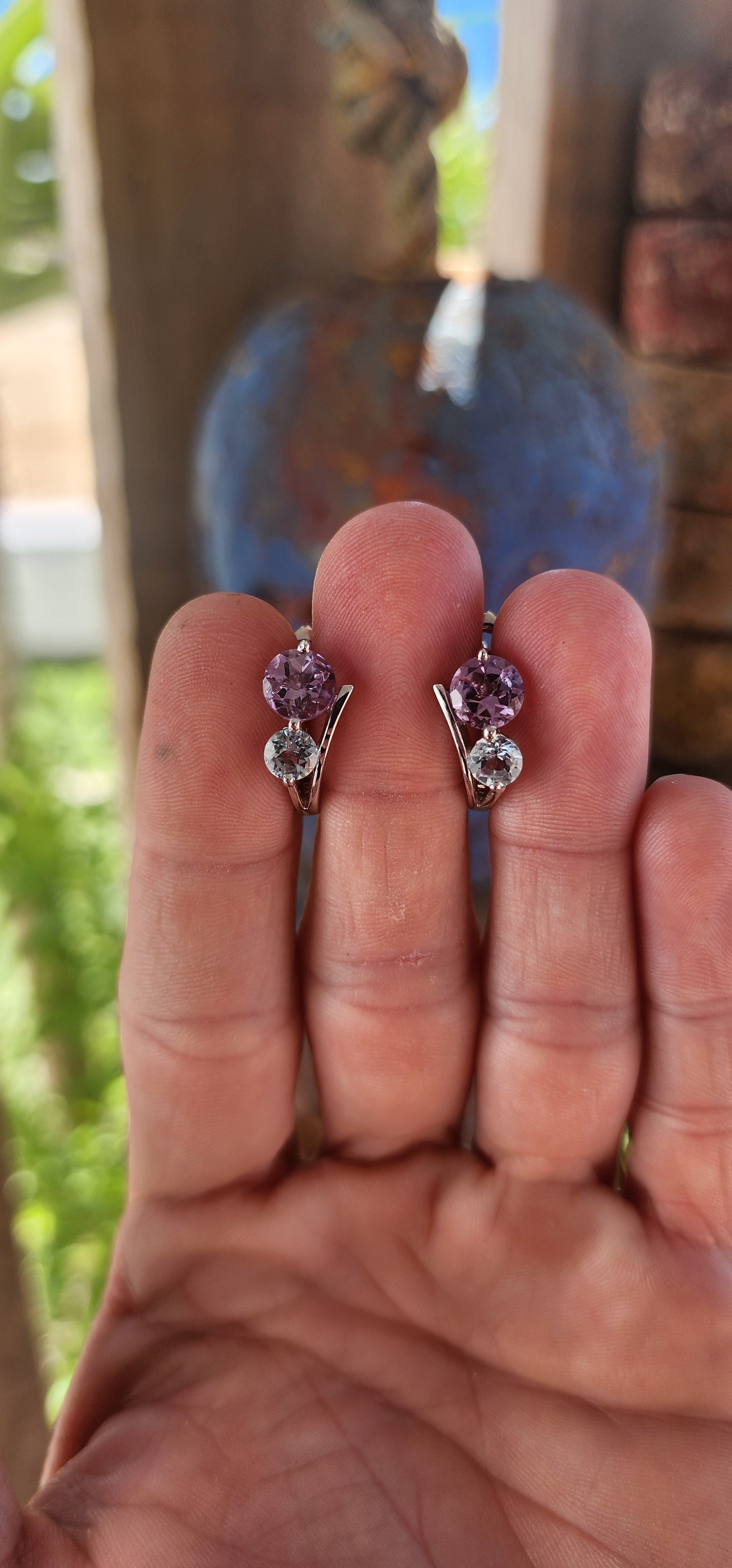 Like a stardust-kissed evening sky, these sterling silver huggie style earrings blend the mystical charm of twilight hues with the elegance of timeless craftsmanship.
