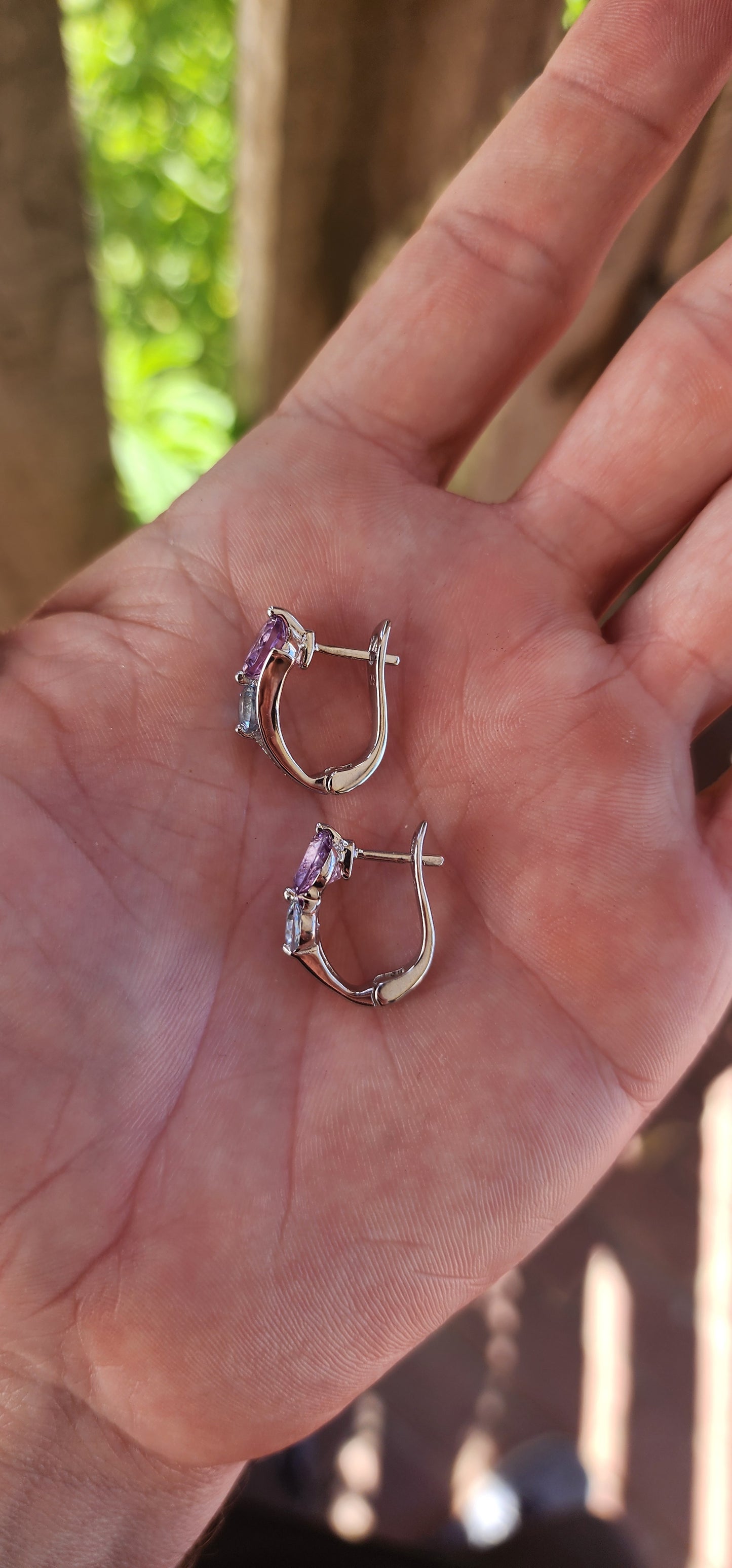Like a stardust-kissed evening sky, these sterling silver huggie style earrings blend the mystical charm of twilight hues with the elegance of timeless craftsmanship.