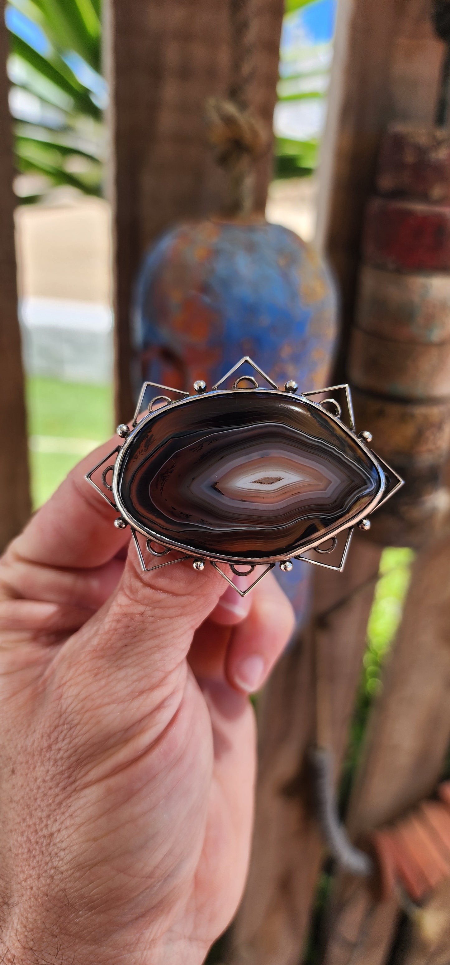 This vintage mid-century sterling silver and banded agate brooch is a true statement piece—bold, earthy, and steeped in artistic craftsmanship.
