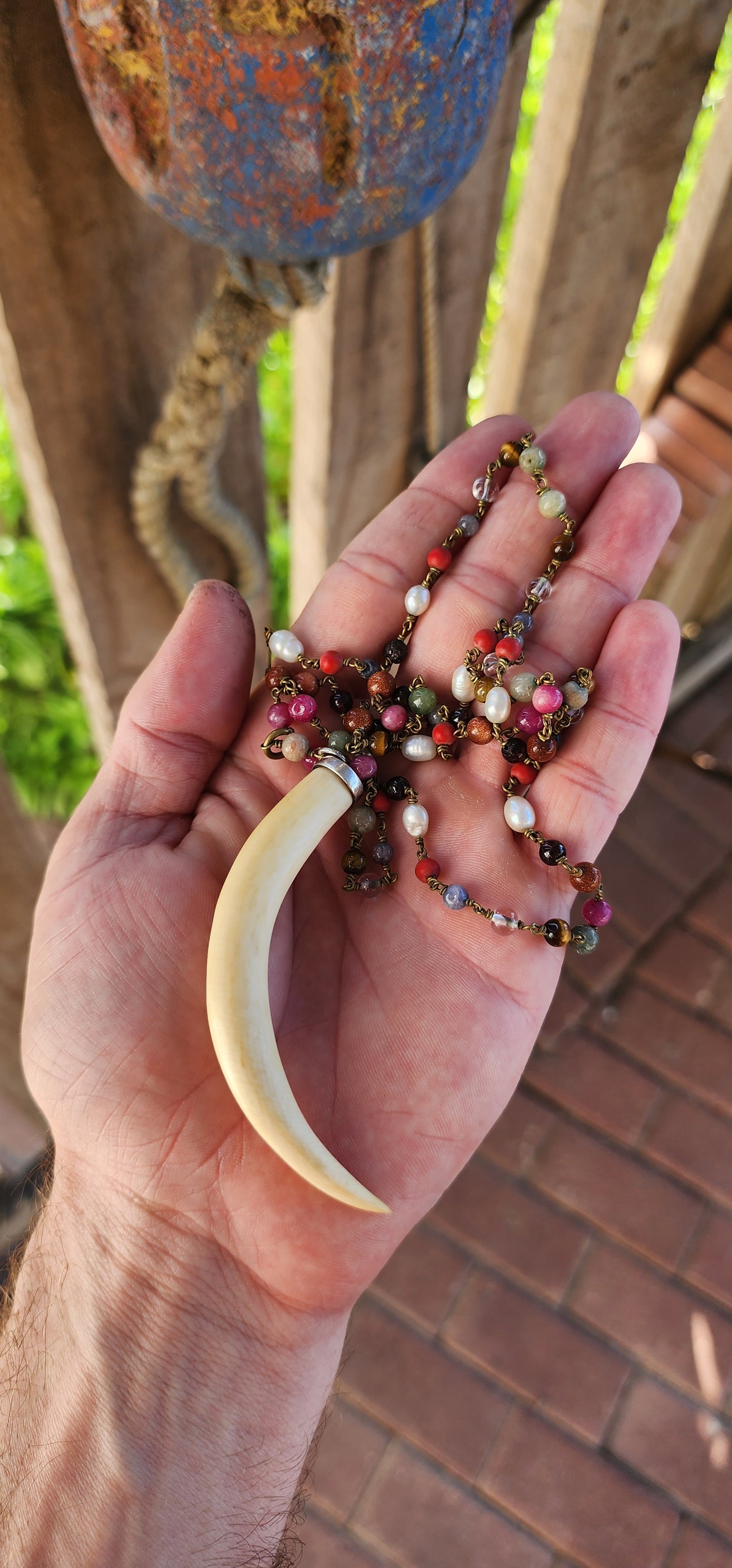 This large pre-ban ivory and sterling silver tusk pendant necklace is an absolute showstopper—bold, eclectic, and steeped in history. It’s the kind of piece that effortlessly blends tribal elegance, bohemian flair, and artisanal craftsmanship.