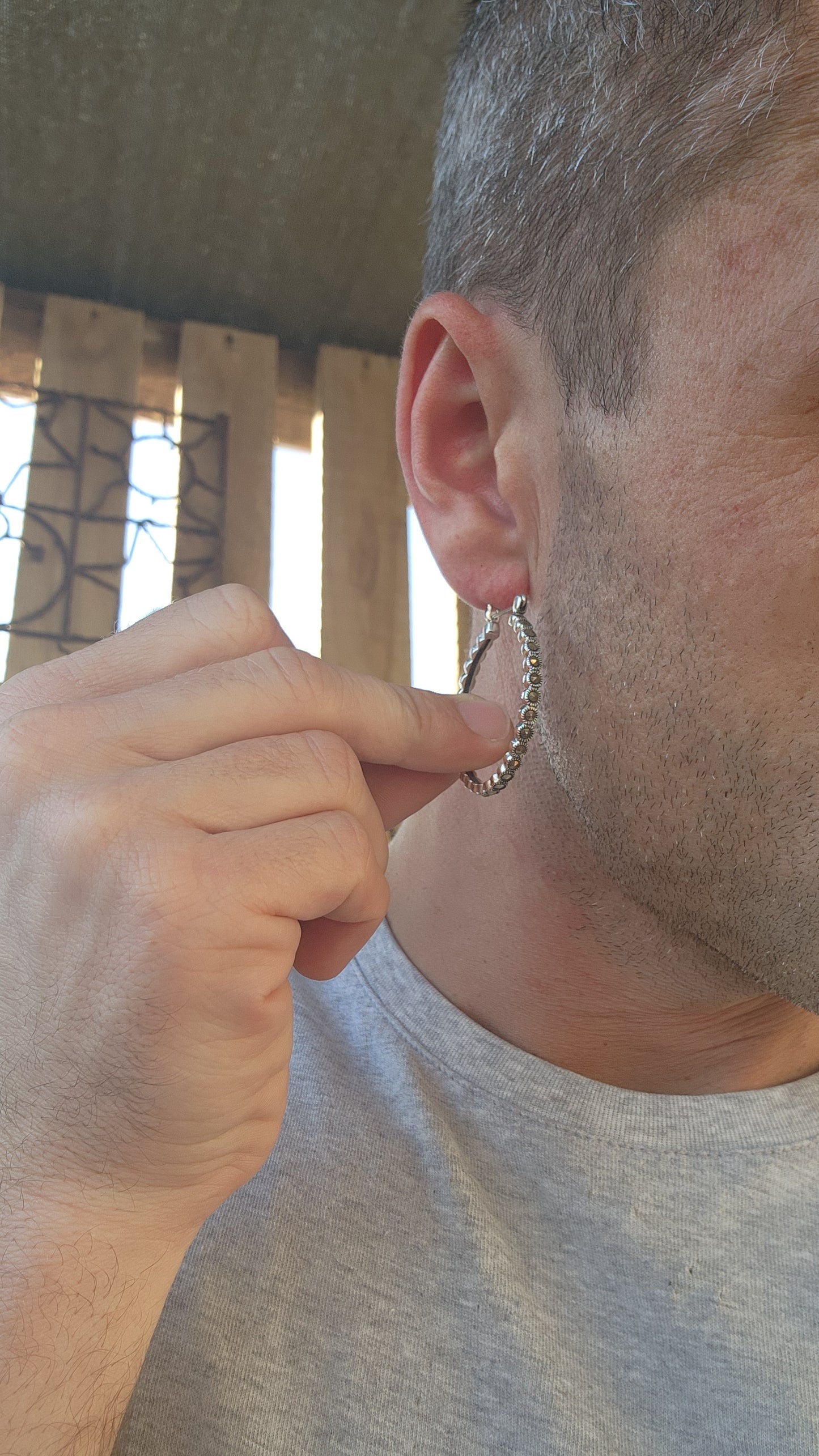 These trusty pair of generous-sized sterling silver hoop earrings are the epitome of vintage-inspired glamour and versatility. These statement hoops are crafted in lustrous sterling silver, exuding a timeless elegance.