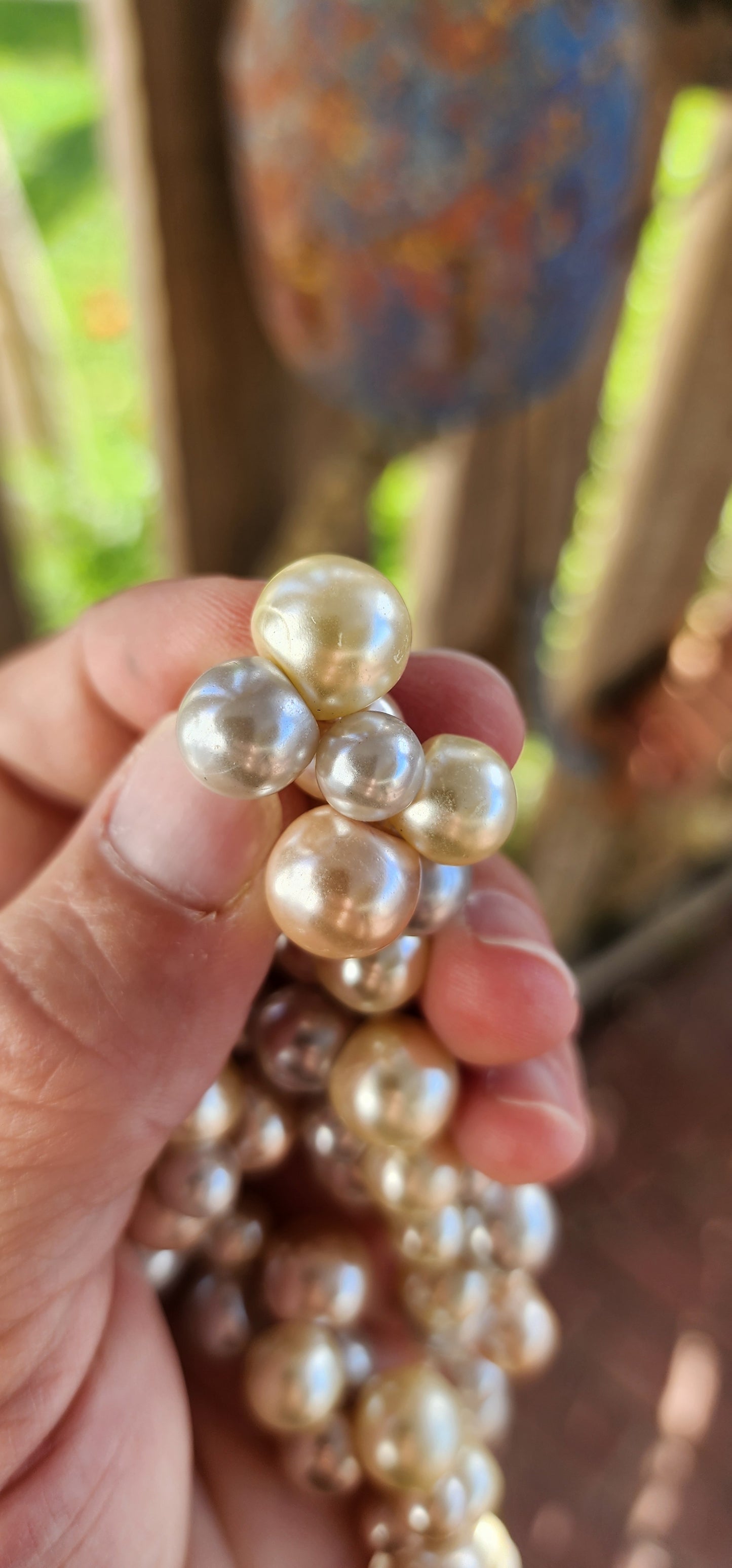 This playful vintage 1980s faux pearl necklace is what happens when elegance decides to let its hair down and throw a garden party! Featuring a joyous jumble of creamy vanilla, dreamy dove-grey, and soft peach faux pearls.