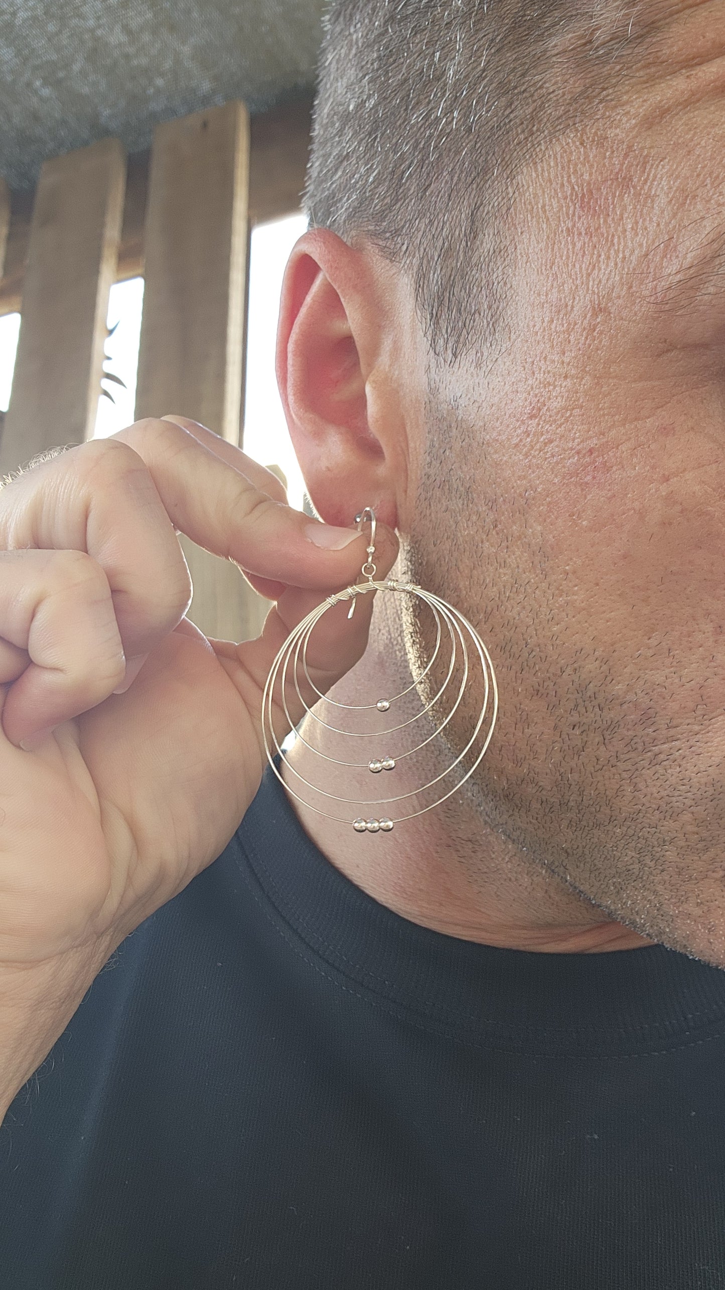 These sculptural stunners are a kinetic dream in sterling silver. Like minimalist mobiles plucked straight from a Calder sketch, each earring features five progressively sized, ultra-fine wire hoops nested within one another, curving in perfect harmony.