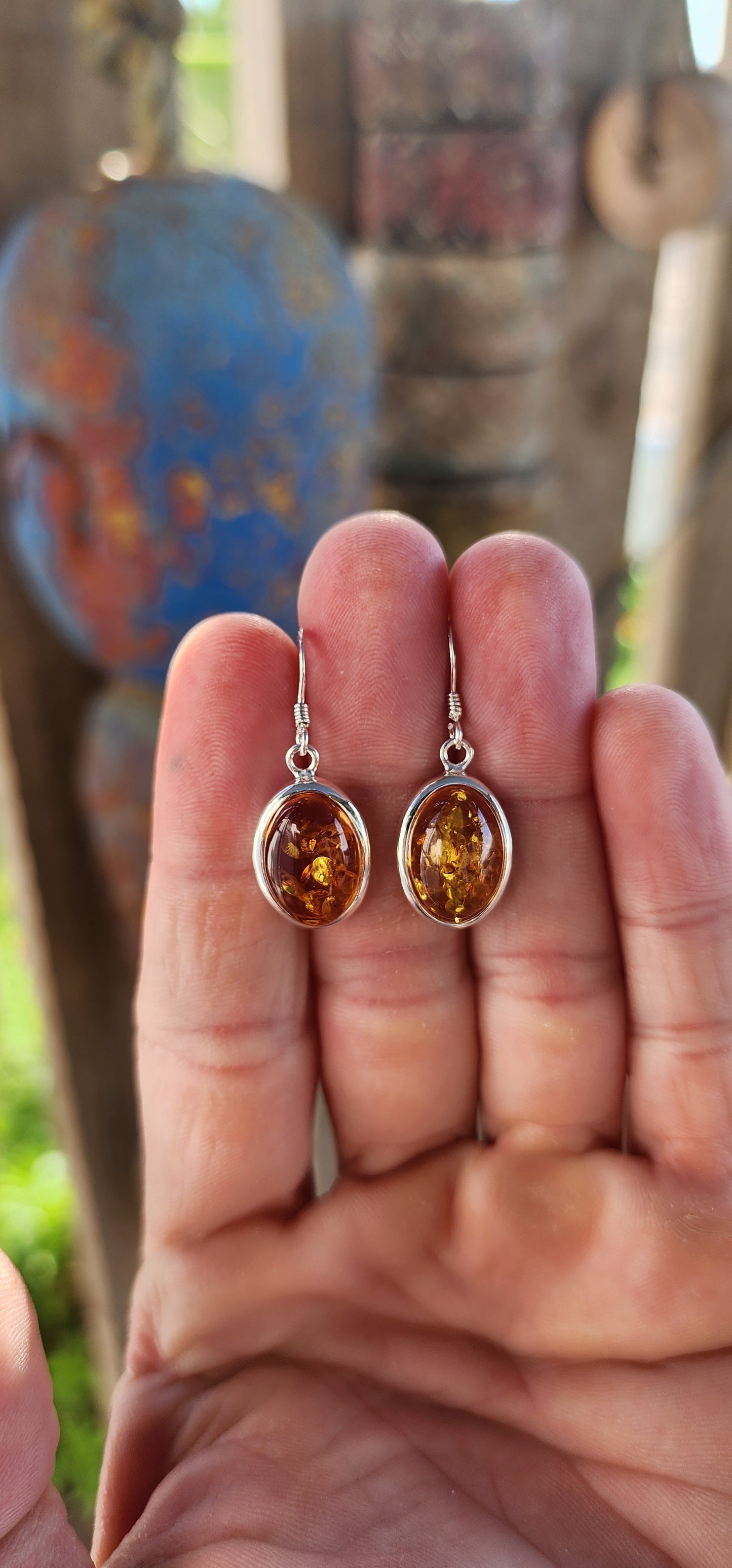 These beautiful earrings are bringing prehistoric glam to the party! Each drop features a glowing oval cabochon of genuine Baltic amber, bezel-set in polished sterling silver.