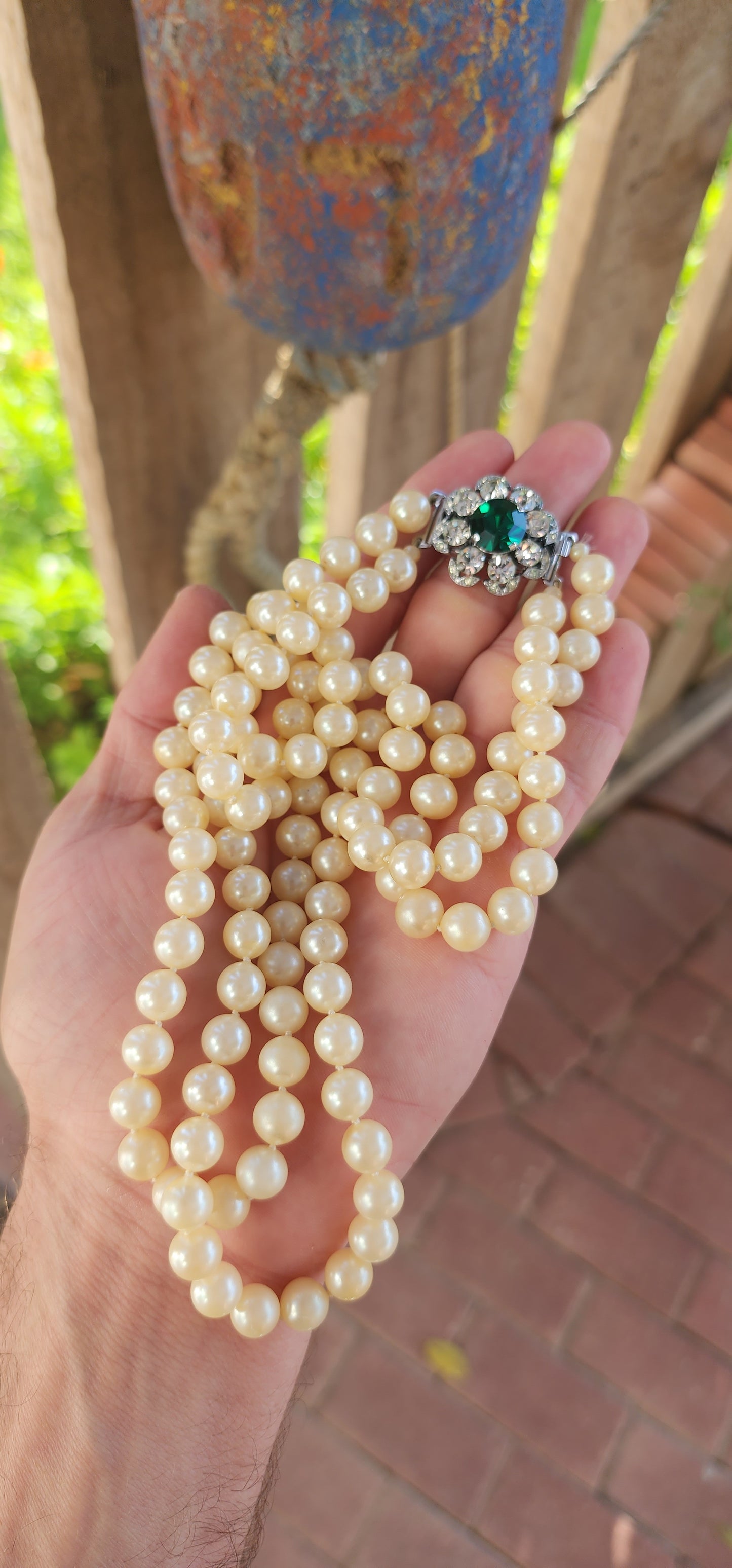 This fabulous Art Deco-era double strand costume necklace, dating to the glitzy 1940s, is pure vintage elegance with a side of silver screen sparkle. The strands are composed of rich, creamy glass faux pearls, each one lovingly hand-knotted.