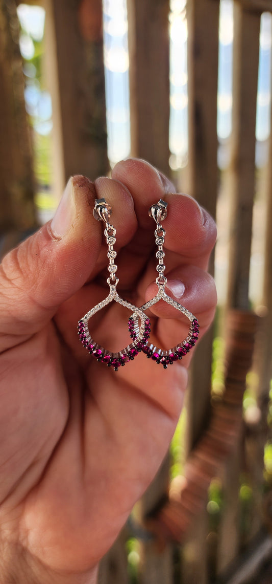 These dazzling drop earrings are where playful charm meets red carpet elegance.
