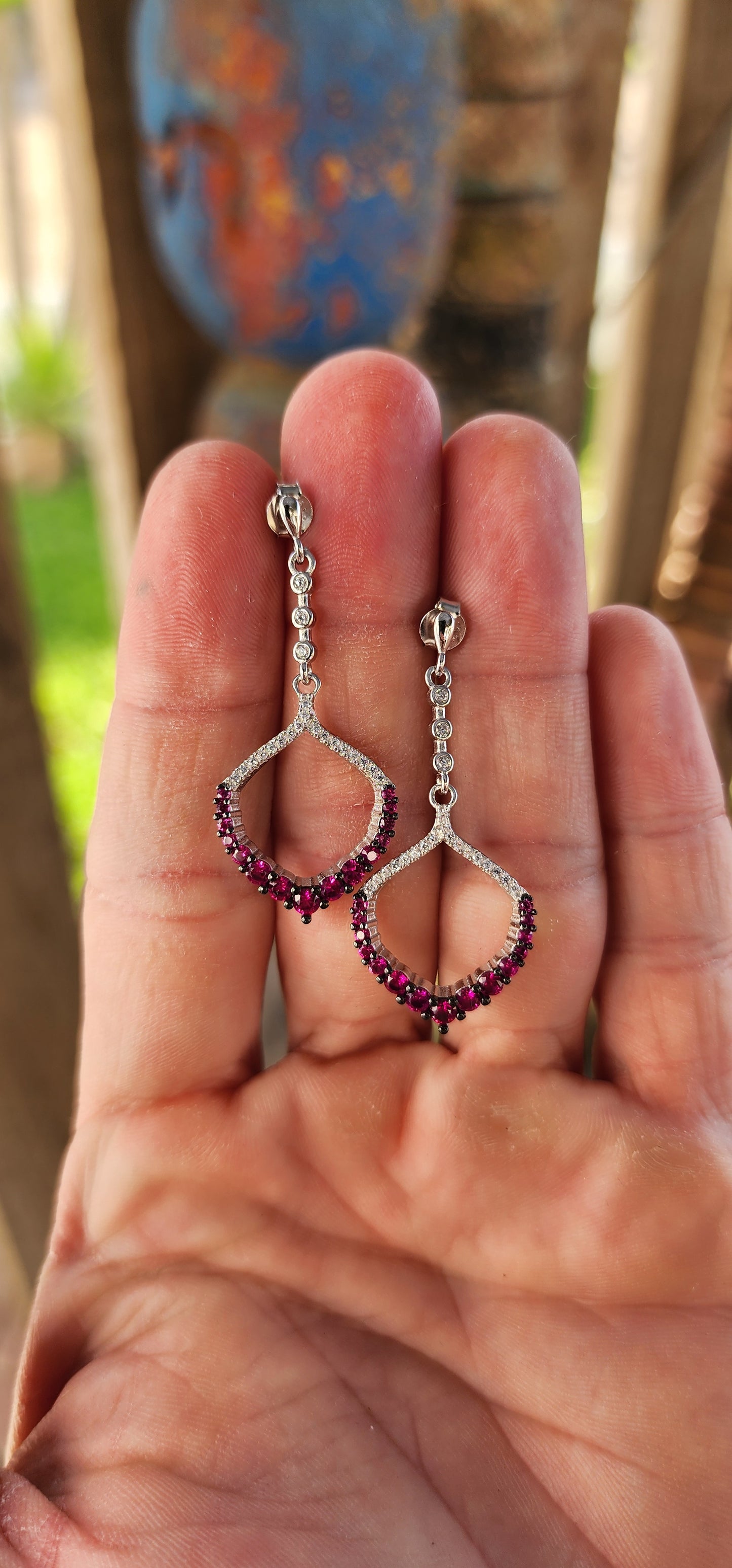 These dazzling drop earrings are where playful charm meets red carpet elegance.