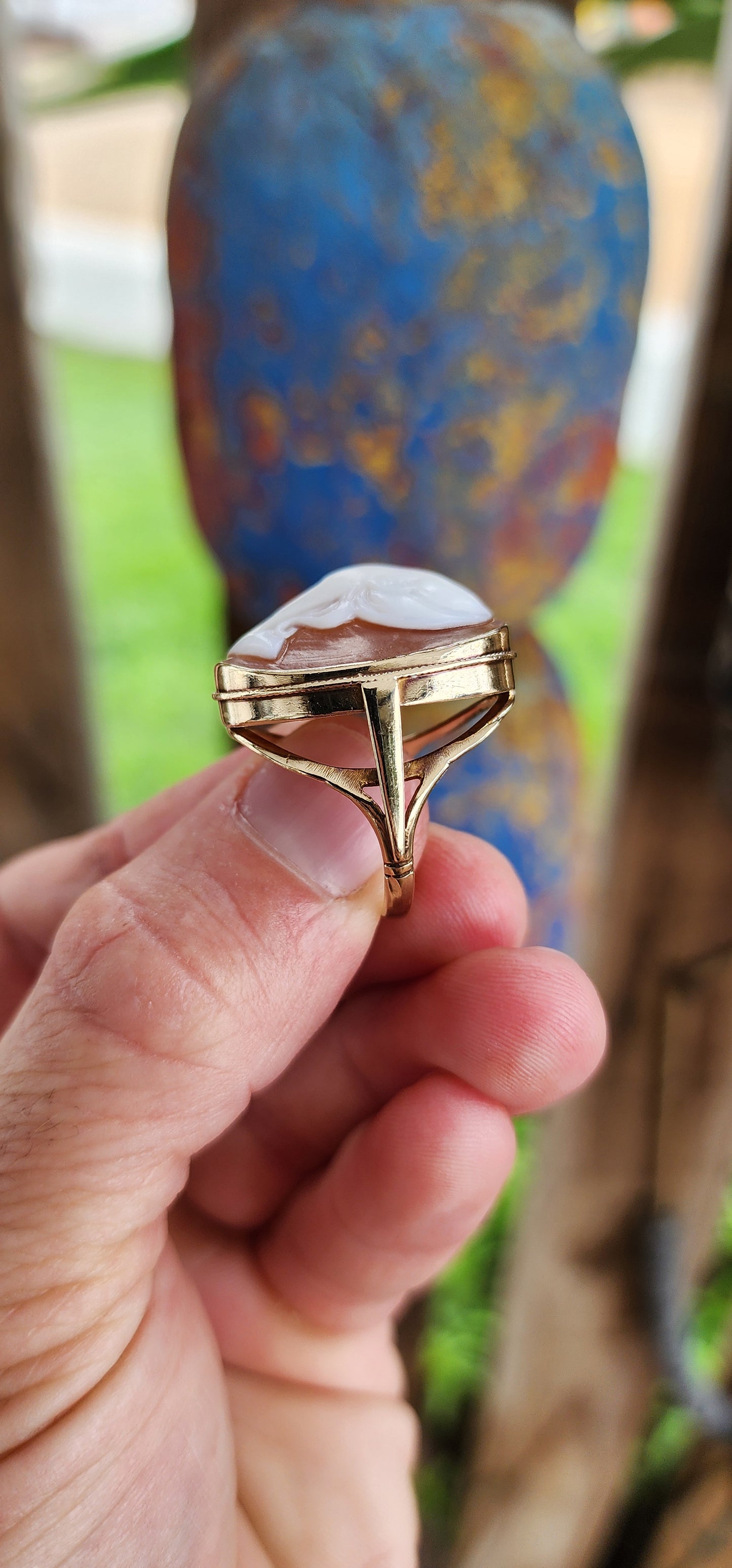A Splendid Testament to Edwardian Elegance: An Early 20th Century High Relief Conch Shell Cameo statement ring in 9ct Rosy Gold.