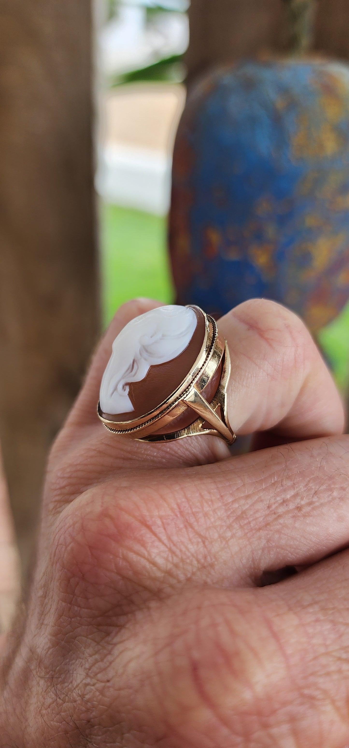 A Splendid Testament to Edwardian Elegance: An Early 20th Century High Relief Conch Shell Cameo statement ring in 9ct Rosy Gold.