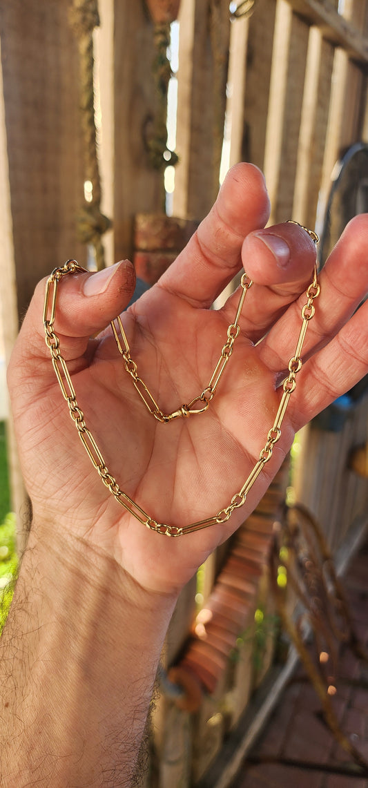 Say hello to a slice of wearable history — a fabulous antique fob chain that marries timeless sophistication with unmistakable golden swagger.This striking beauty is composed entirely of solid 18ct buttery yellow gold.