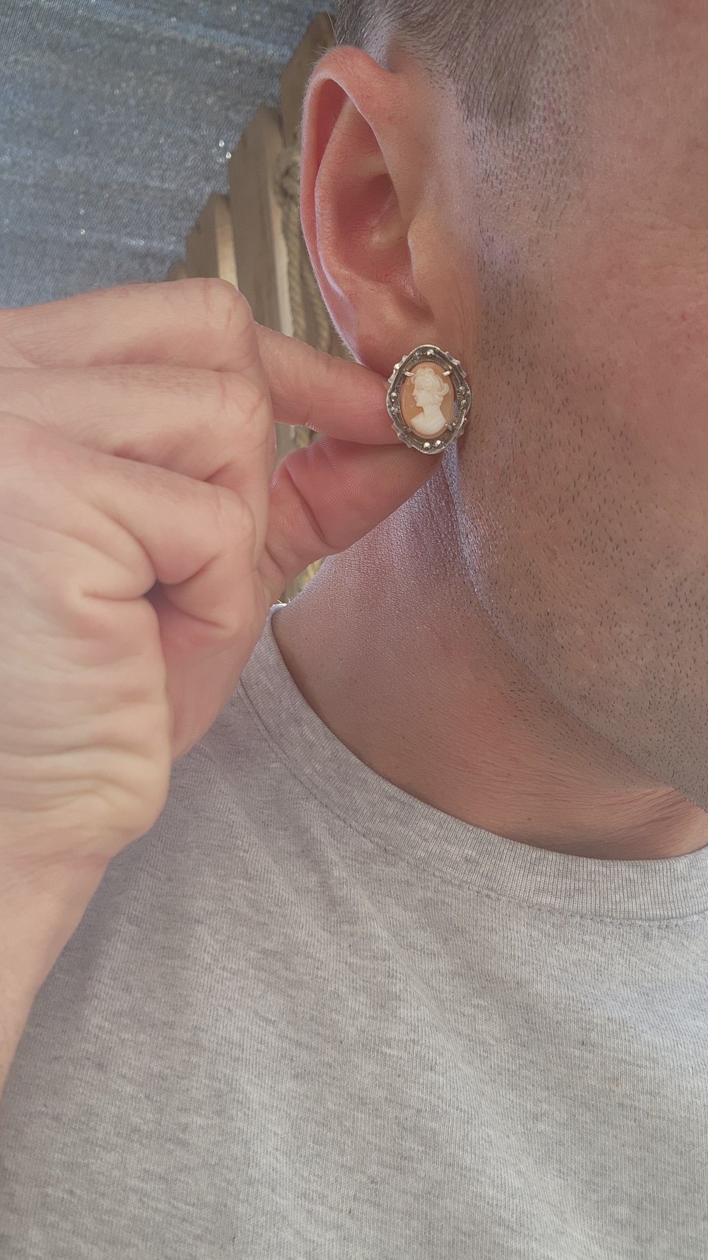 A pair of vintage Italian 800 Silver and Conch Shell Cameo Clip-On Earrings, Circa 1940's.
Gracefully embodying the timeless elegance of Belle Époque refinement, this exquisite pair of vintage earrings is a masterclass in classical ornamentation.