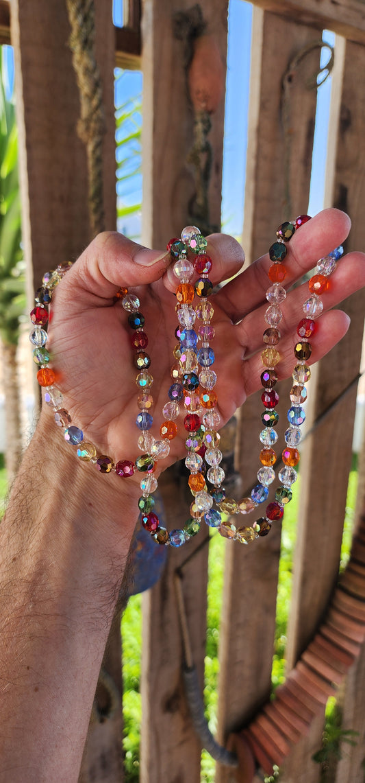 Step into a world of vintage whimsy and luminous color with this enchanting extra-length carnival necklace—an irresistible symphony of sparkle and joy.