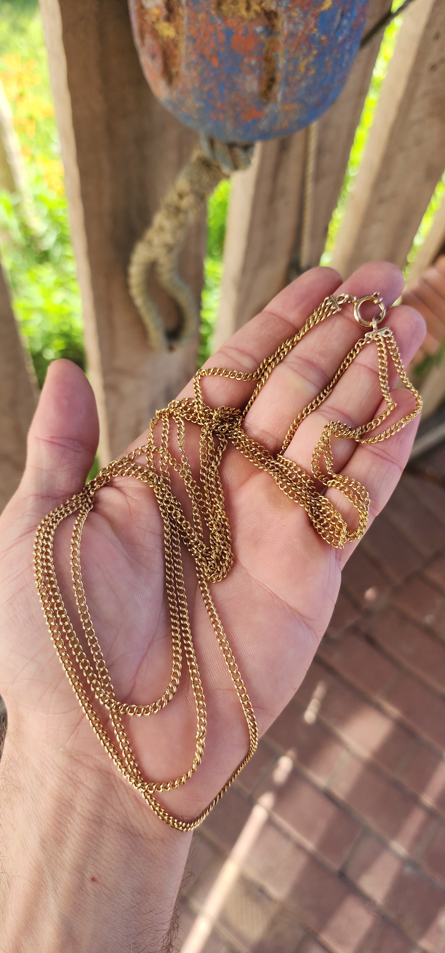 Behold this spectacular antique late Victorian-era 14ct yellow gold three-strand curb link chain necklace—a piece that whispers tales of timeless elegance and genteel grandeur.