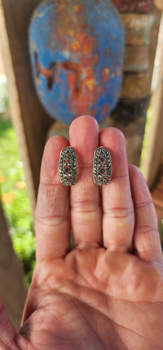 These vintage-inspired sterling silver earrings are like miniature Deco cathedrals for your ears—sophisticated, structured, and sparkling with timeless charm.