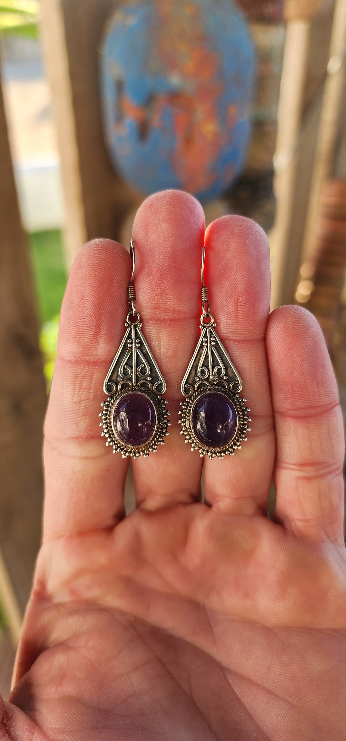 Channeling the spirit of bohemian wanderers and mystical moonlit markets, this fabulous pair of sterling silver drop earrings is pure wearable enchantment.
