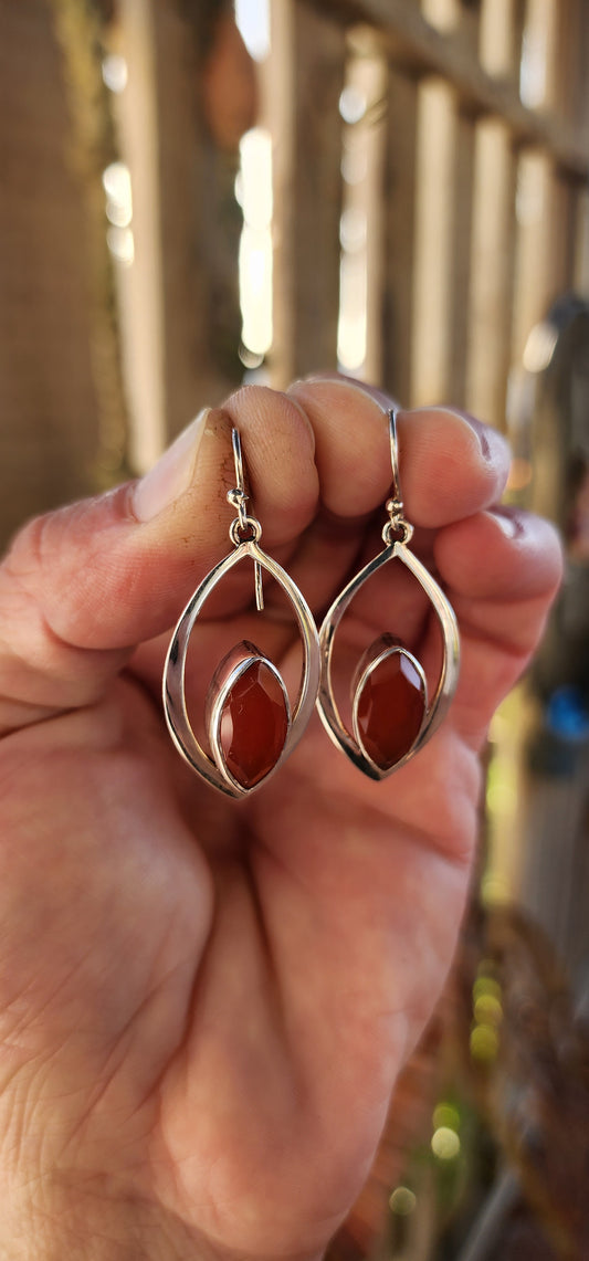 These earrings are like miniature sculptures—modernist marvels that flirt with geometry and gemstone magic!