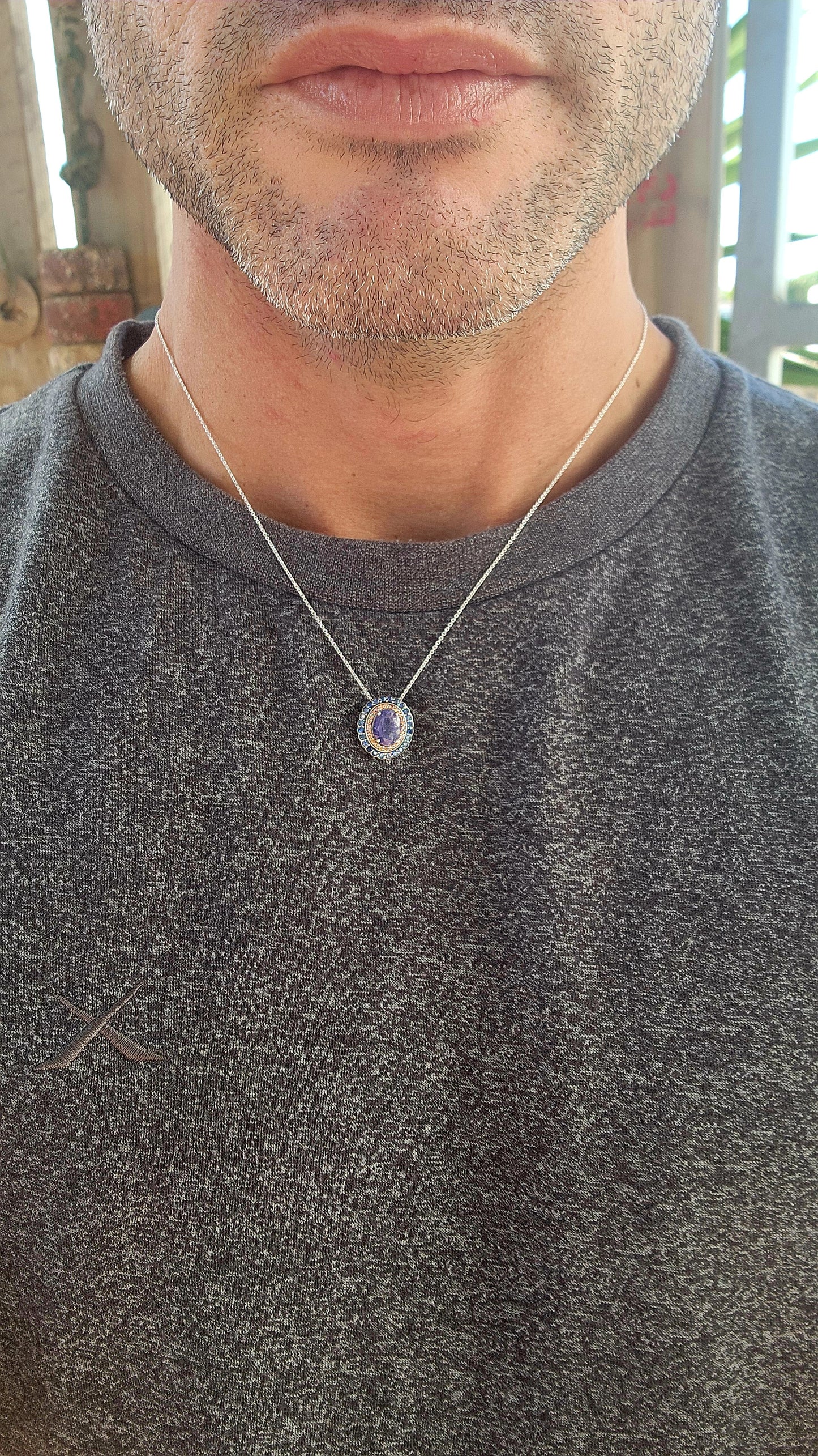 This sterling silver pendant is pure twilight magic captured in a frame of fire and midnight.
