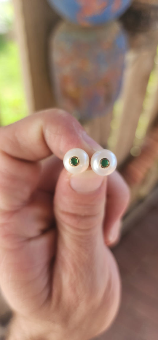 Add a dash of magic and a royal whisper of emerald enchantment with these captivating faux emerald and pearl stud earrings! Like tiny orbs of moonlight kissed by spring forests.