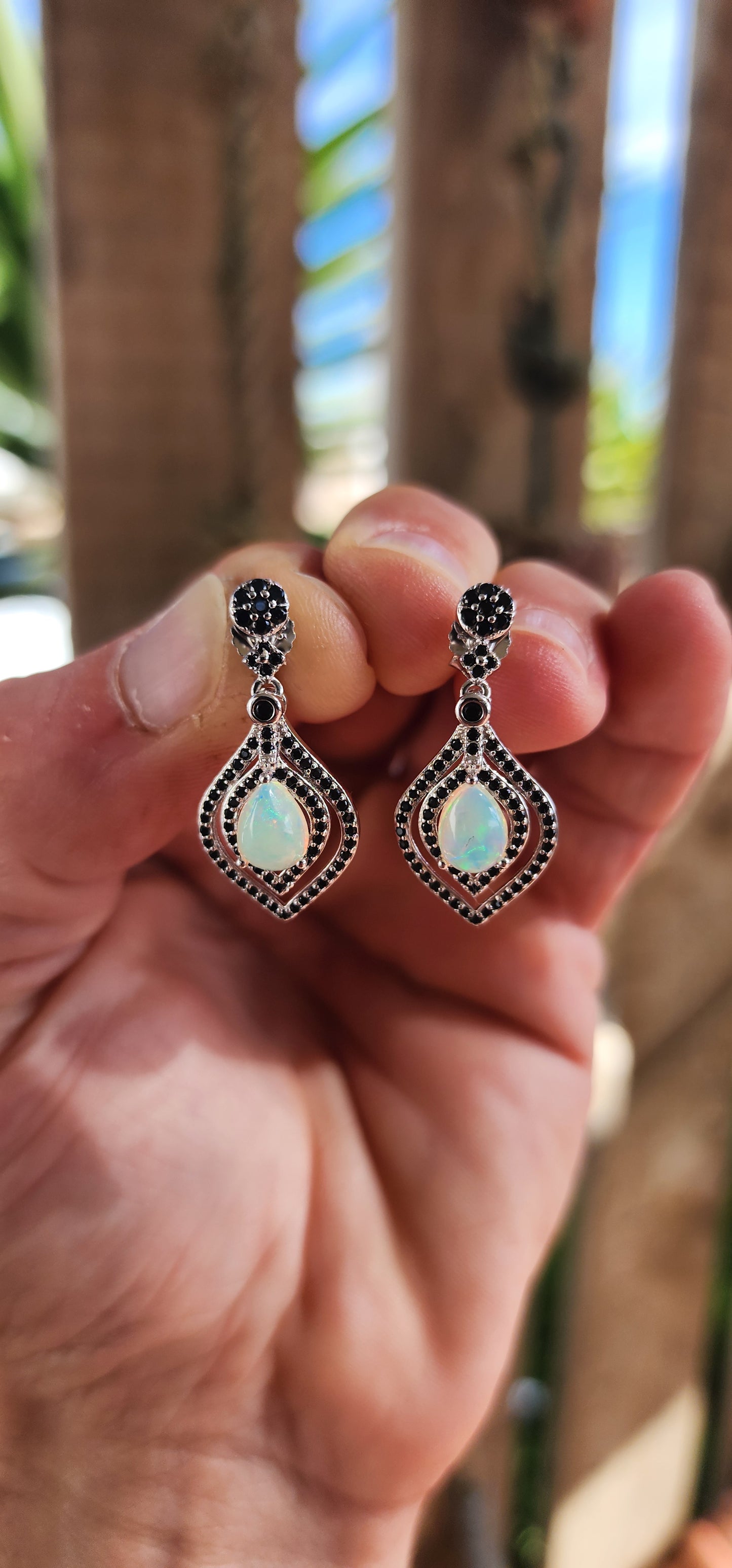 Opal Reverie – A Dance of Fire and Shadow!
Drape your ears in mystique with these absolutely showstopping sterling silver drop earrings, where celestial shimmer meets gothic glamour!