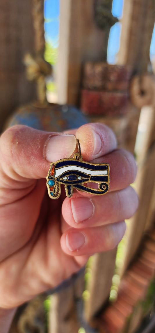 Behold—an amulet fit for a Pharaoh's neck or a modern-day adventurer channeling divine protection! This striking antique pendant is a radiant artifact from the Art Deco era, when the world fell under the spell of Egyptian Revival.