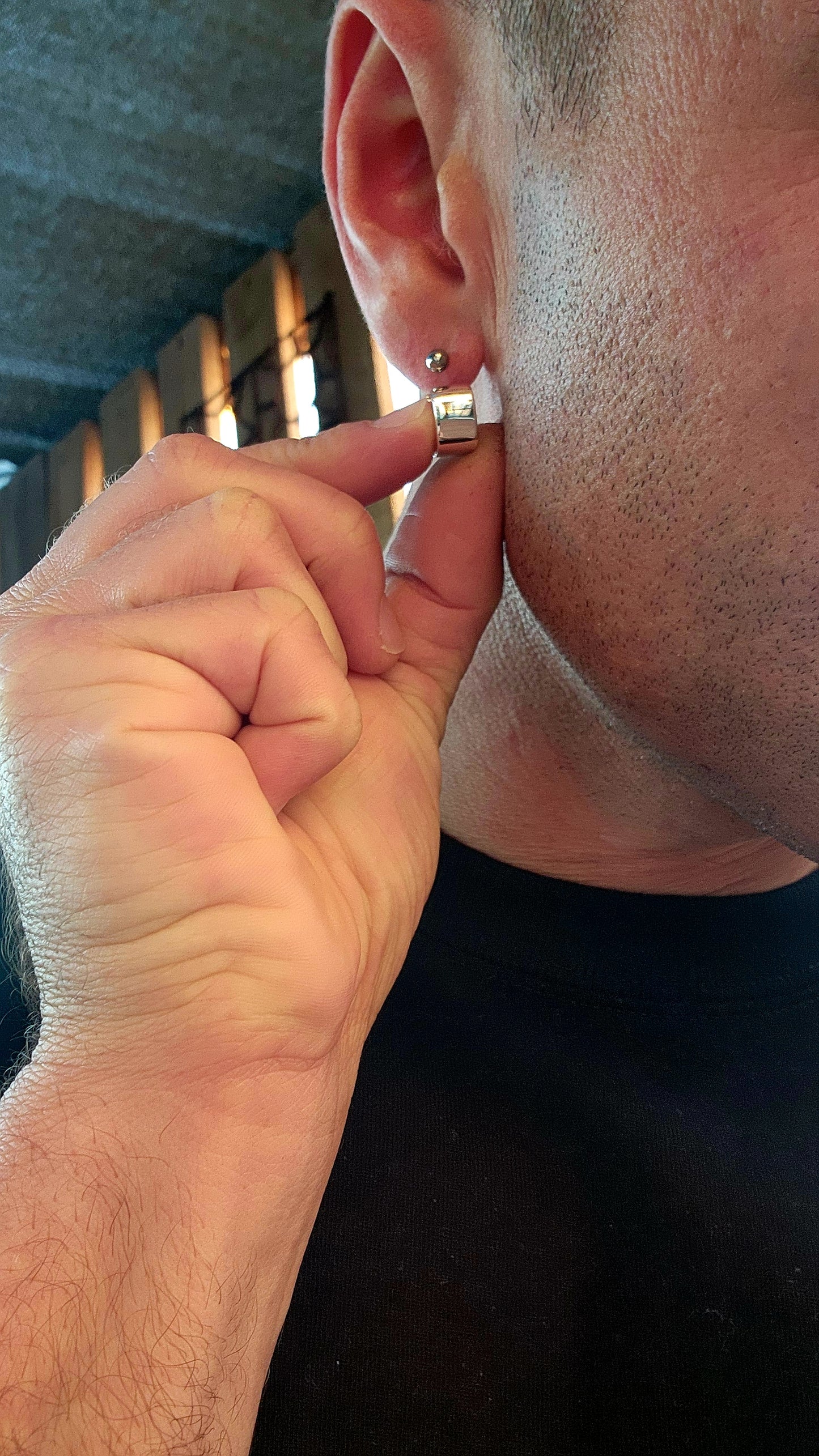 These sterling silver huggie earrings are a masterclass in modern minimalism, sculpted in a bold rounded-rectangular shape that hugs the ear with contemporary charm.