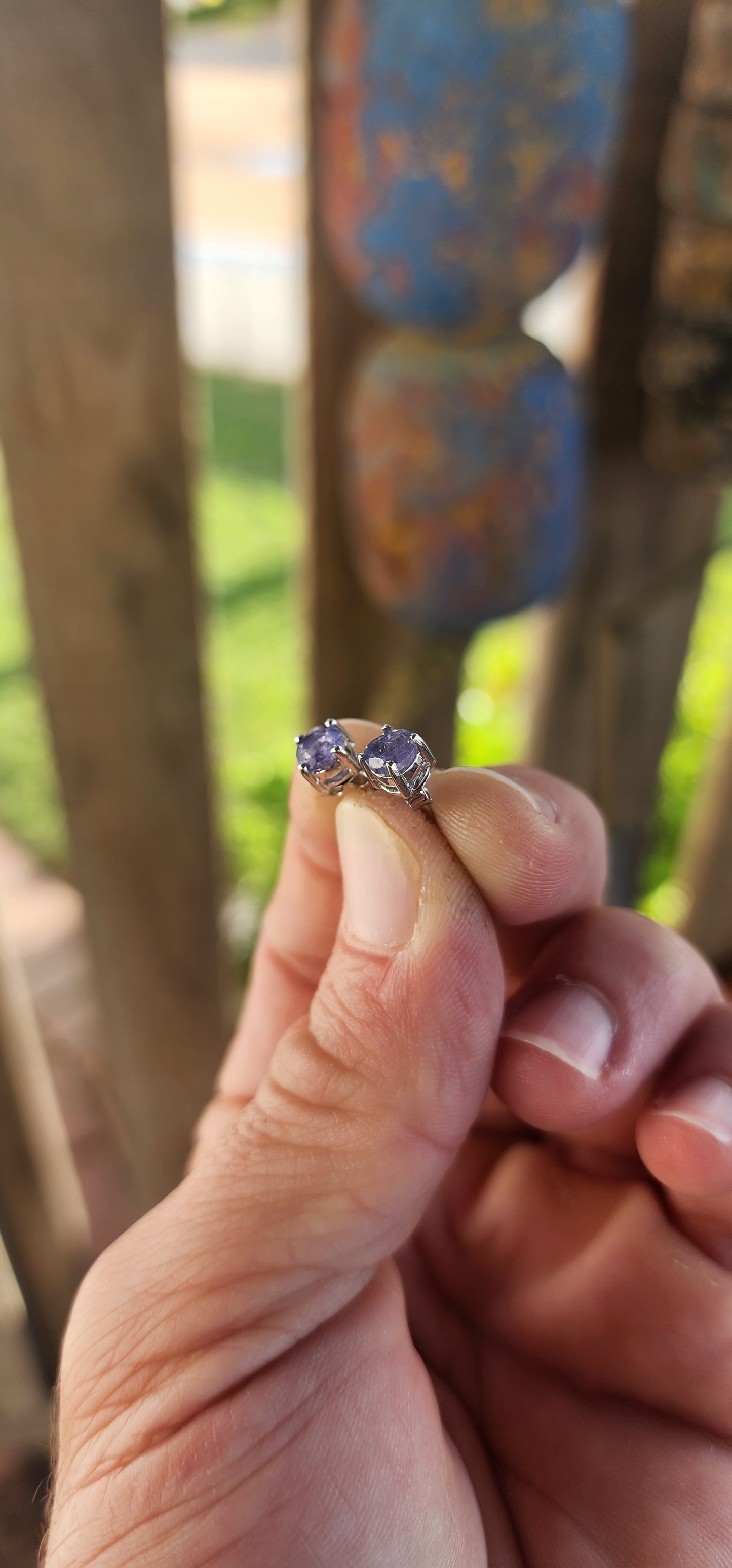 Small in size but rich in presence, these sterling silver stud earrings are a refined nod to nature’s twilight palette. Each earring showcases a captivating round-cut tanzanite—glowing with that unmistakable periwinkle hue.