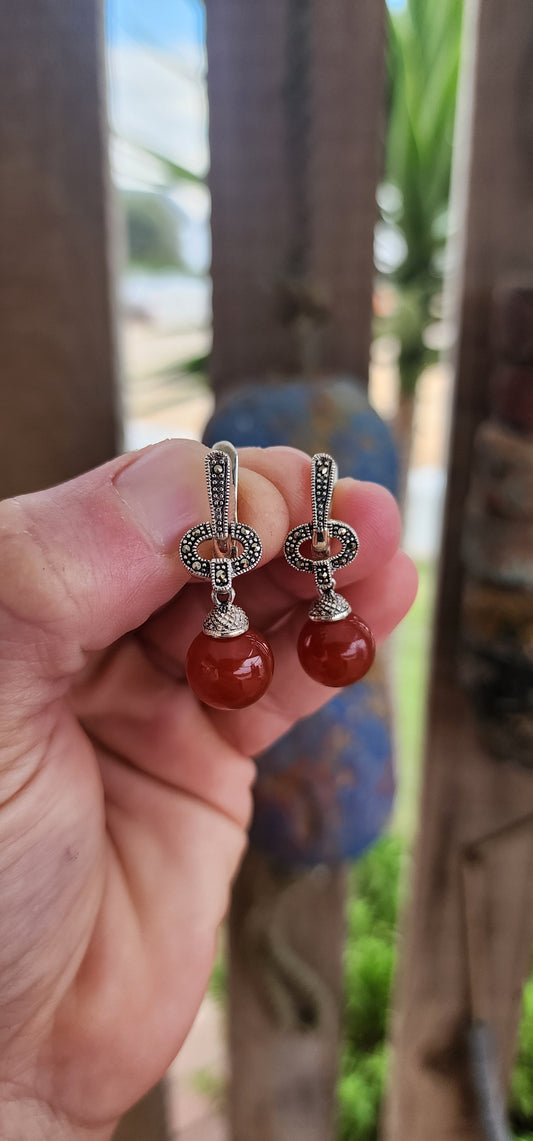 These marvelous Art Deco-inspired earrings are a sultry swing of sophistication and vintage style charm! Crafted in sterling silver, they begin with an articulated bar, encrusted with shimmering marcasites.