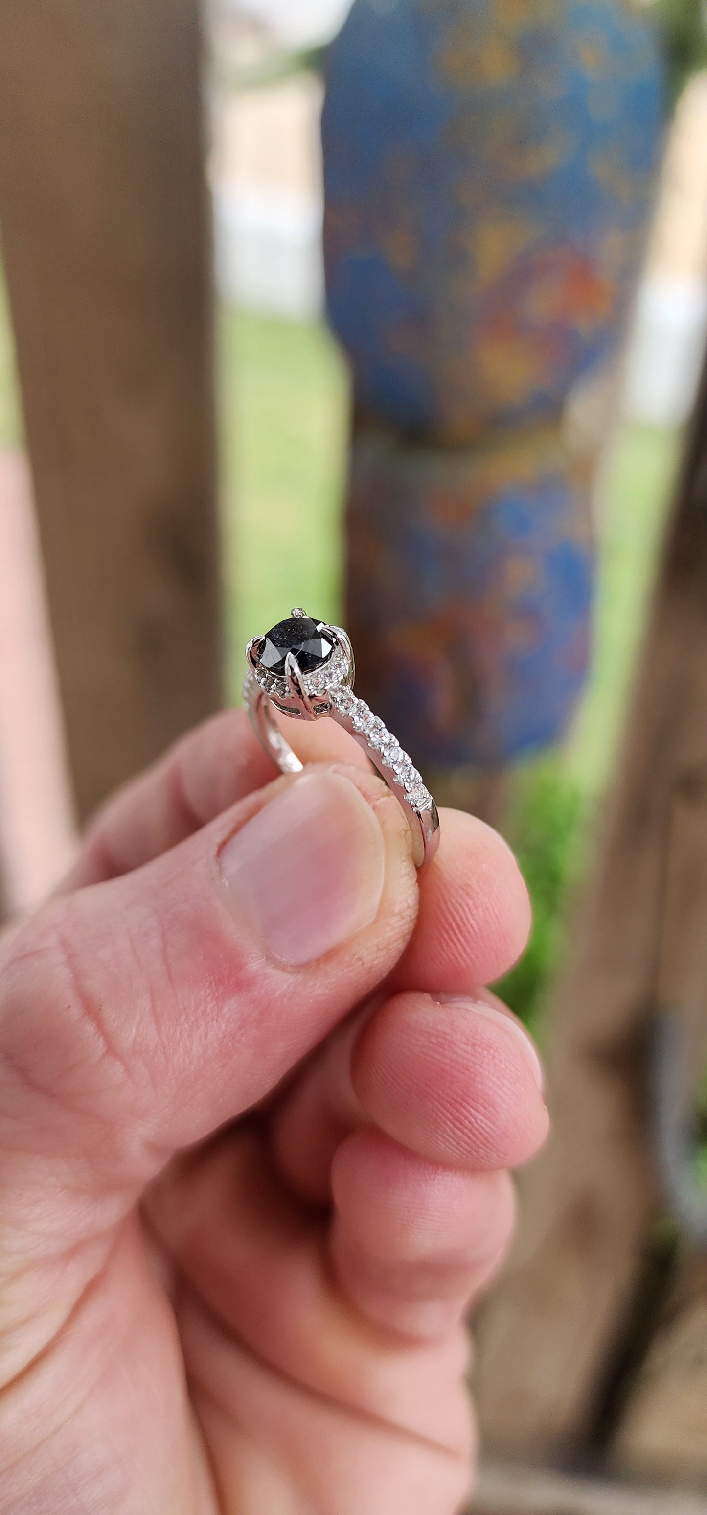 Prepare to swoon—this breathtaking sterling silver solitaire ring is pure romantic rebellion. At its heart sits a bold and dramatic round-cut black diamond, prong-set in gothic claw-like talons that grip it like a dragon guards its treasure.