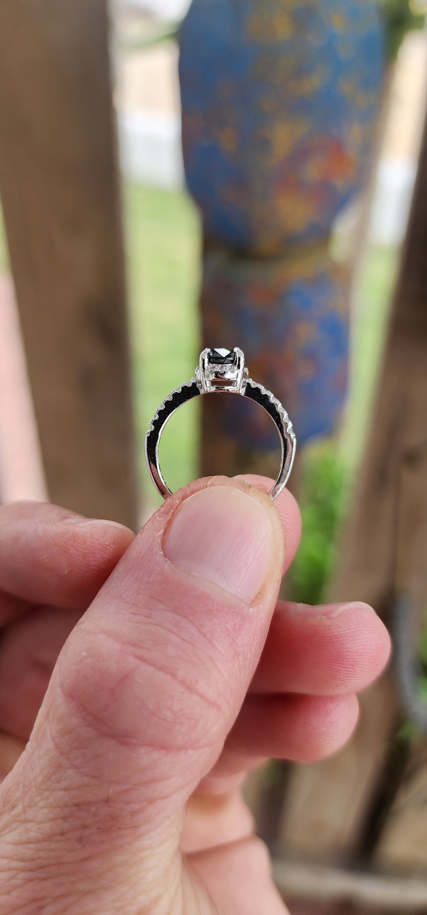 Prepare to swoon—this breathtaking sterling silver solitaire ring is pure romantic rebellion. At its heart sits a bold and dramatic round-cut black diamond, prong-set in gothic claw-like talons that grip it like a dragon guards its treasure.
