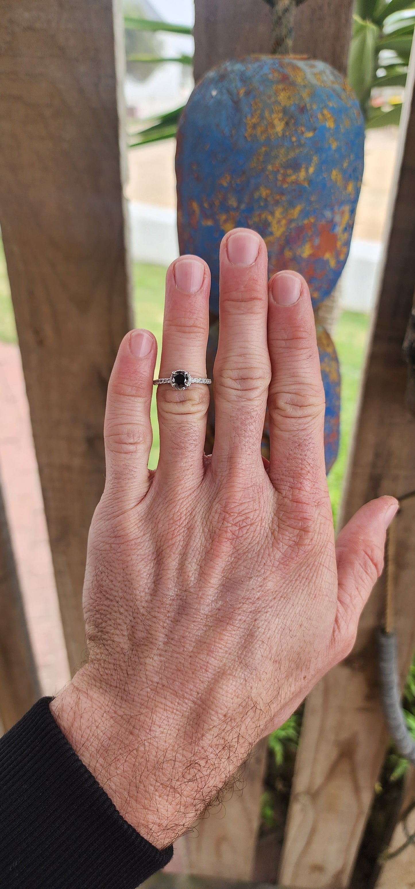 Prepare to swoon—this breathtaking sterling silver solitaire ring is pure romantic rebellion. At its heart sits a bold and dramatic round-cut black diamond, prong-set in gothic claw-like talons that grip it like a dragon guards its treasure.