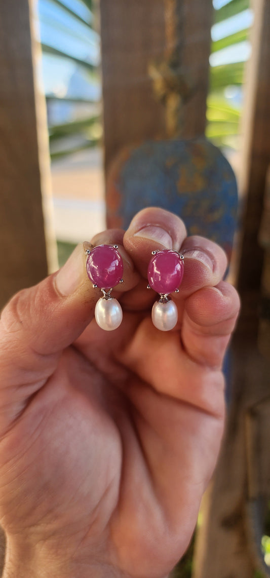 Dramatic yet delicate, these earrings are like love letters from two different worlds—where the fiery charm of rubies meets the soft whisper of pearls in perfect harmony.