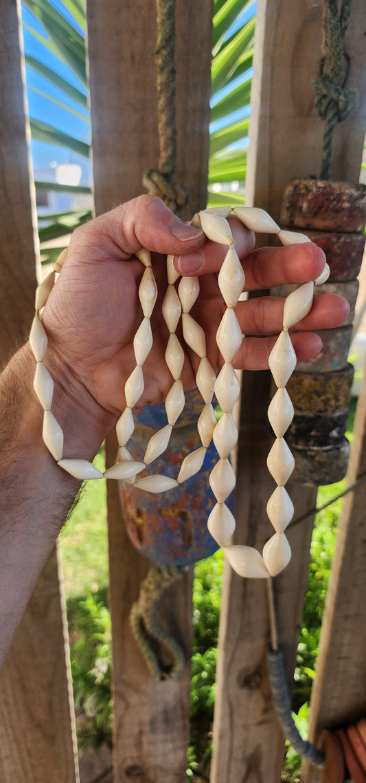 Extraordinary antique pre-ban ivory necklace—a true treasure carved by hand. This exquisite piece boasts a luxuriously extra length strand of marquise-shaped ivory beads, each one individually hand-carved with a soft, organic sheen that only time can best