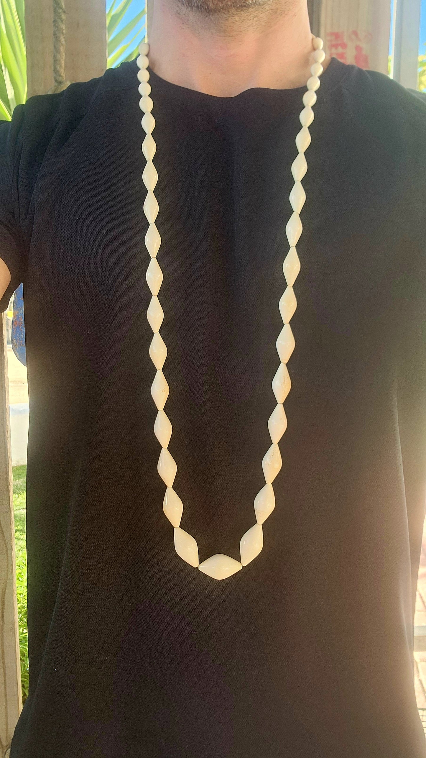 Extraordinary antique pre-ban ivory necklace—a true treasure carved by hand. This exquisite piece boasts a luxuriously extra length strand of marquise-shaped ivory beads, each one individually hand-carved with a soft, organic sheen that only time can best
