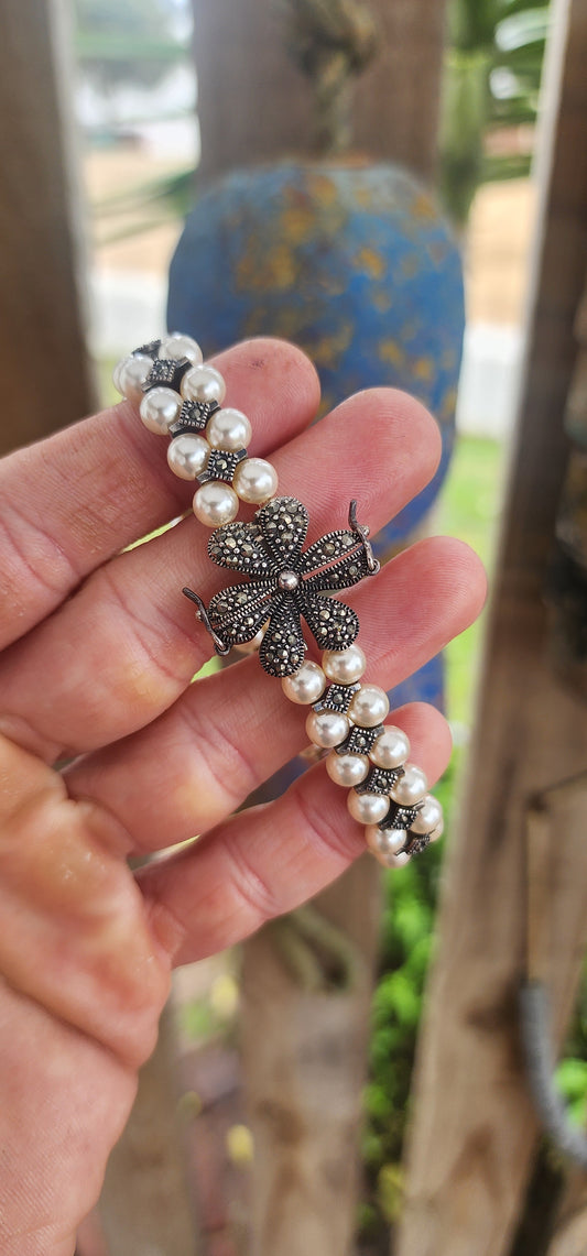 "Pearls & Petals: A Deco Daydream"This enchanting bracelet is crafted in a vintage Art Deco style — capturing the glamour of the 1920s while being a contemporary creation that channels all the charm of yesteryear.