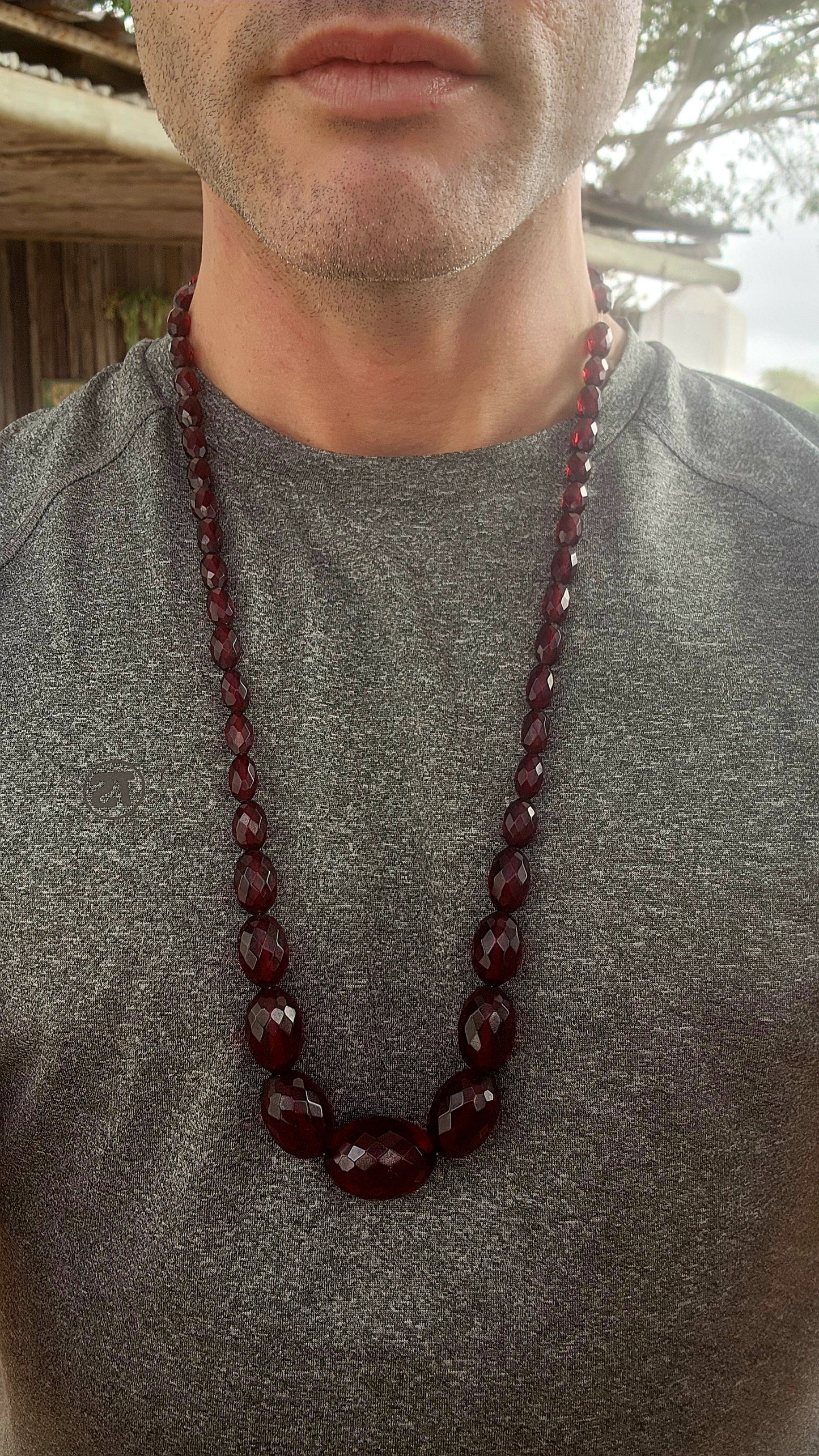 This exquisite vintage necklace is a radiant example of 1930s Art Deco glamour, showcasing hand-faceted cherry Bakelite beads in a beautifully graduated design.