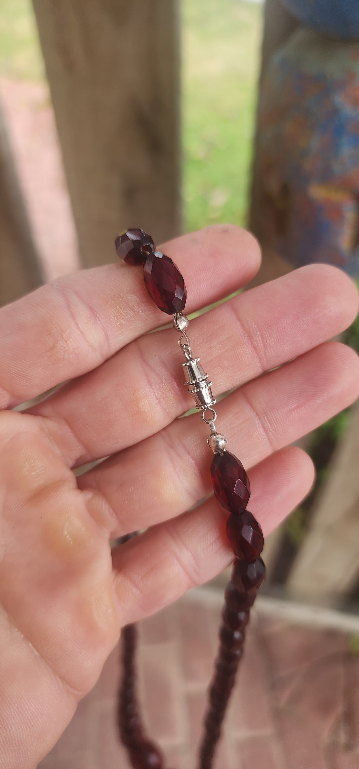 This exquisite vintage necklace is a radiant example of 1930s Art Deco glamour, showcasing hand-faceted cherry Bakelite beads in a beautifully graduated design.