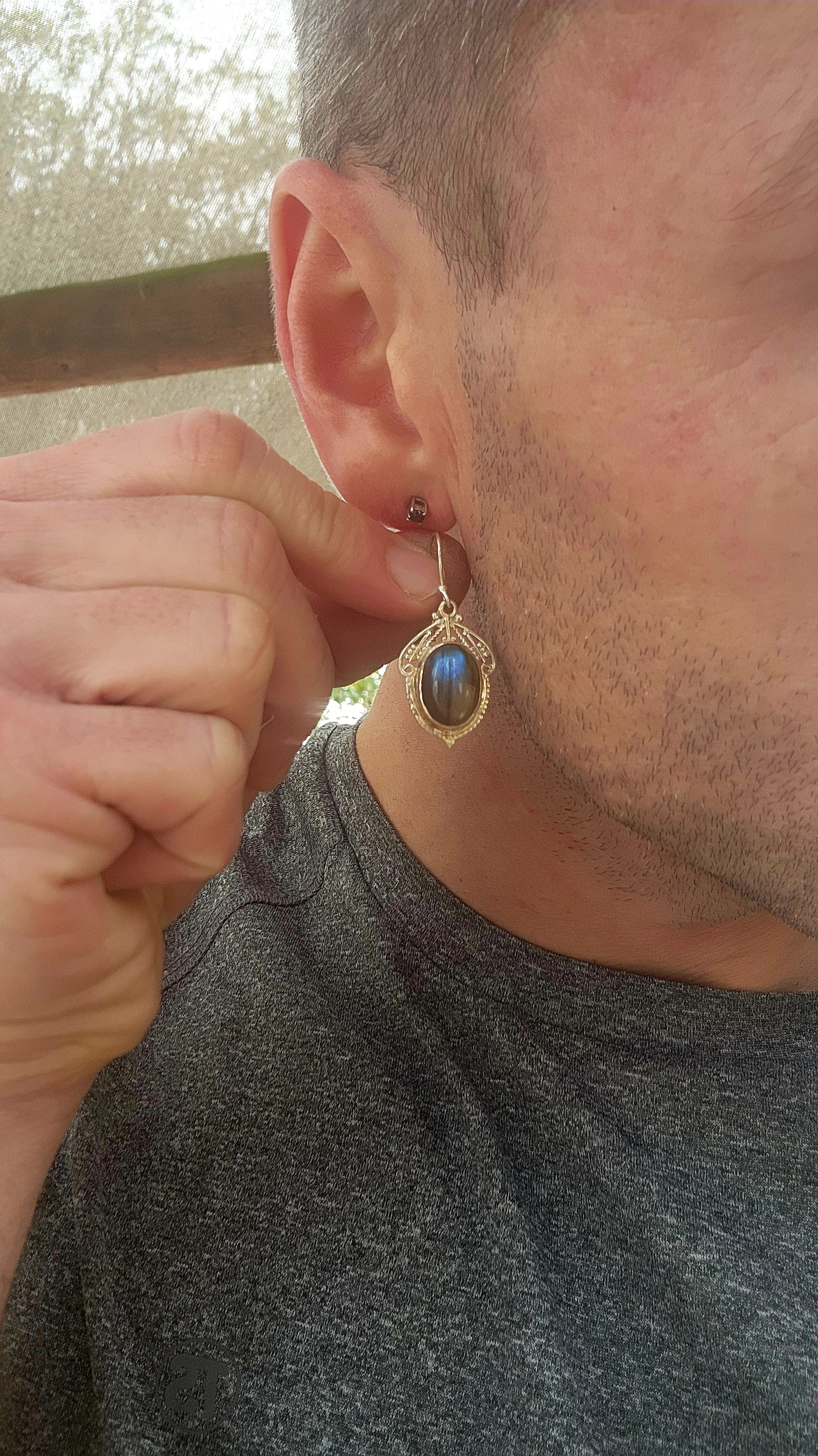 These enchanting sterling silver drop earrings are a romantic nod to the Art Nouveau era, featuring oval labradorite cabochons bezel-set atop intricate lace-like filigree backings.