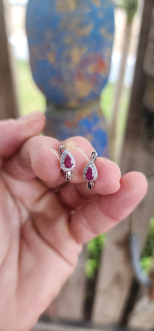 Delicately crafted in glowing sterling silver, these earrings embody sophistication in a compact yet captivating design.