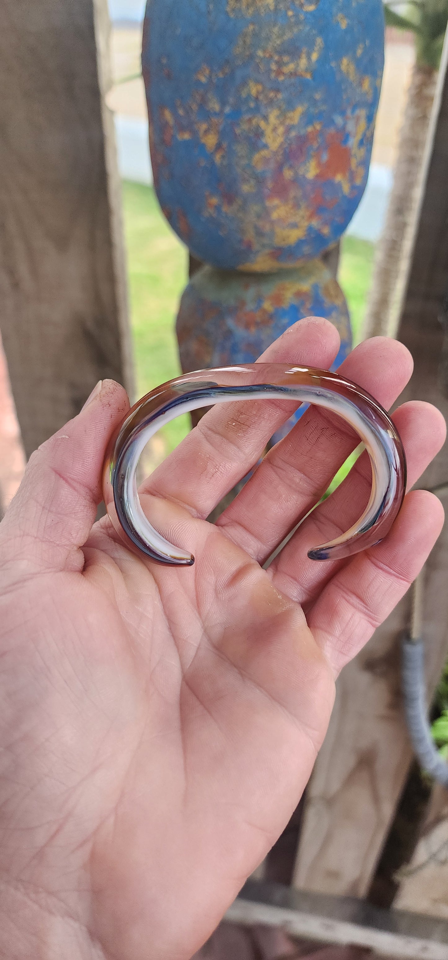 Oh, hello there, statement-maker! 
This eye-catching cuff is not your average wrist candy — it’s a wearable slice of modern art.