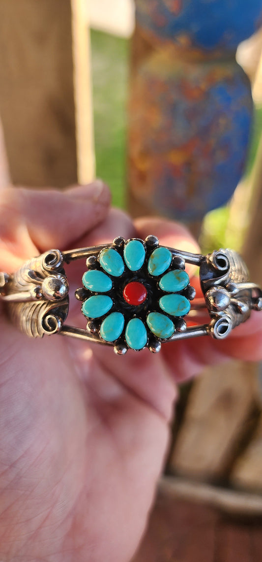 This striking and chunky vintage Southwestern Navajo-style cuff bracelet is a bold testament to both artistry and heritage. Forged in sterling silver, the cuff’s structure is composed of split double bands, giving it a powerful yet airy presence.