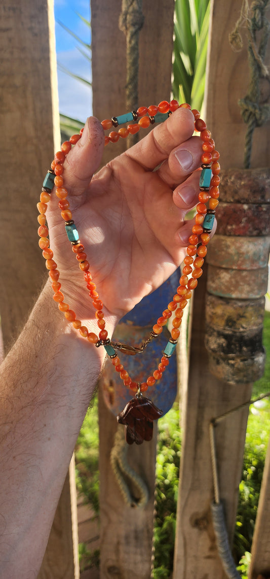 This striking, one-of-a-kind extra-length designer necklace by Beryl Dingemans beautifully fuses organic warmth with a touch of bohemian charm.