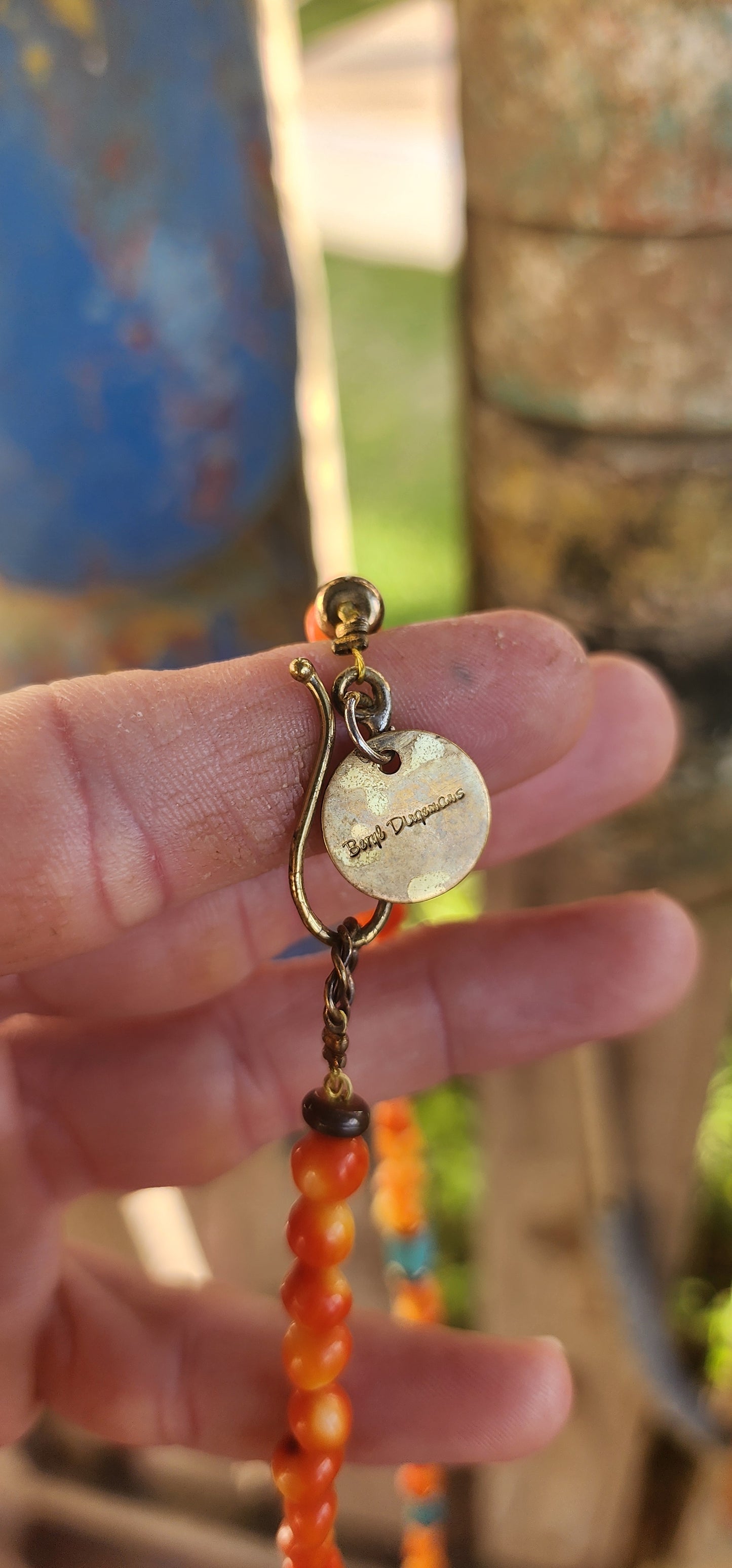 This striking, one-of-a-kind extra-length designer necklace by Beryl Dingemans beautifully fuses organic warmth with a touch of bohemian charm.