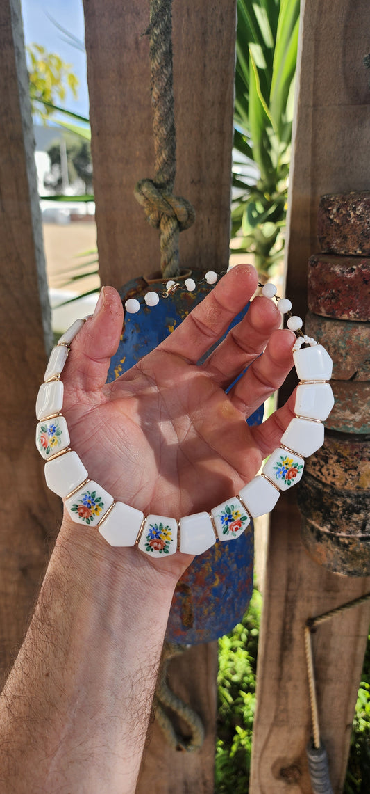 Vintage 1950s German Milk Glass Floral Panel Choker Necklace.
Crafted in West Germany during the 1950s, it showcases the highly prized milk glass — a luscious, opaque white glass popular from the Victorian era well into the mid-20th century.