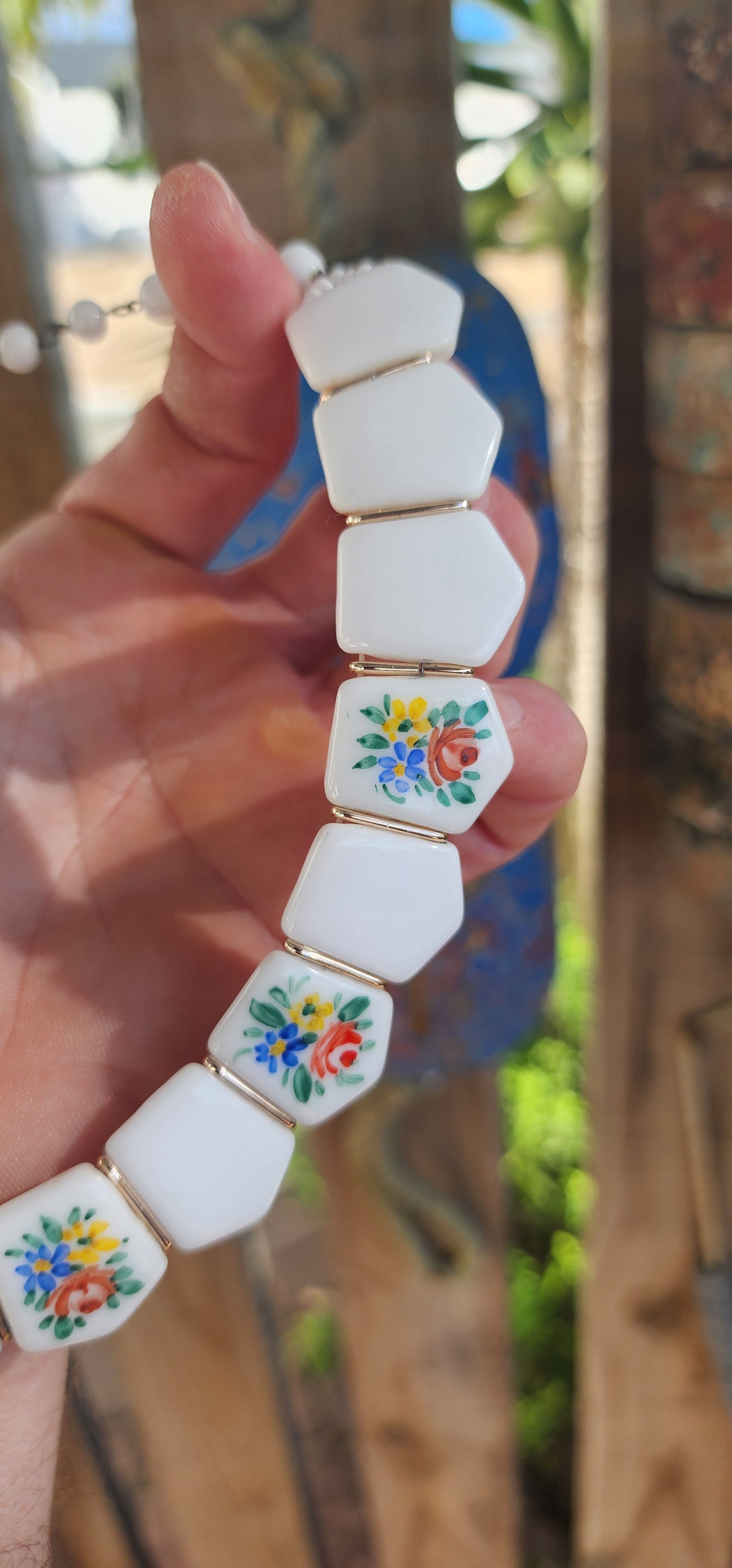 Vintage 1950s German Milk Glass Floral Panel Choker Necklace.
Crafted in West Germany during the 1950s, it showcases the highly prized milk glass — a luscious, opaque white glass popular from the Victorian era well into the mid-20th century.