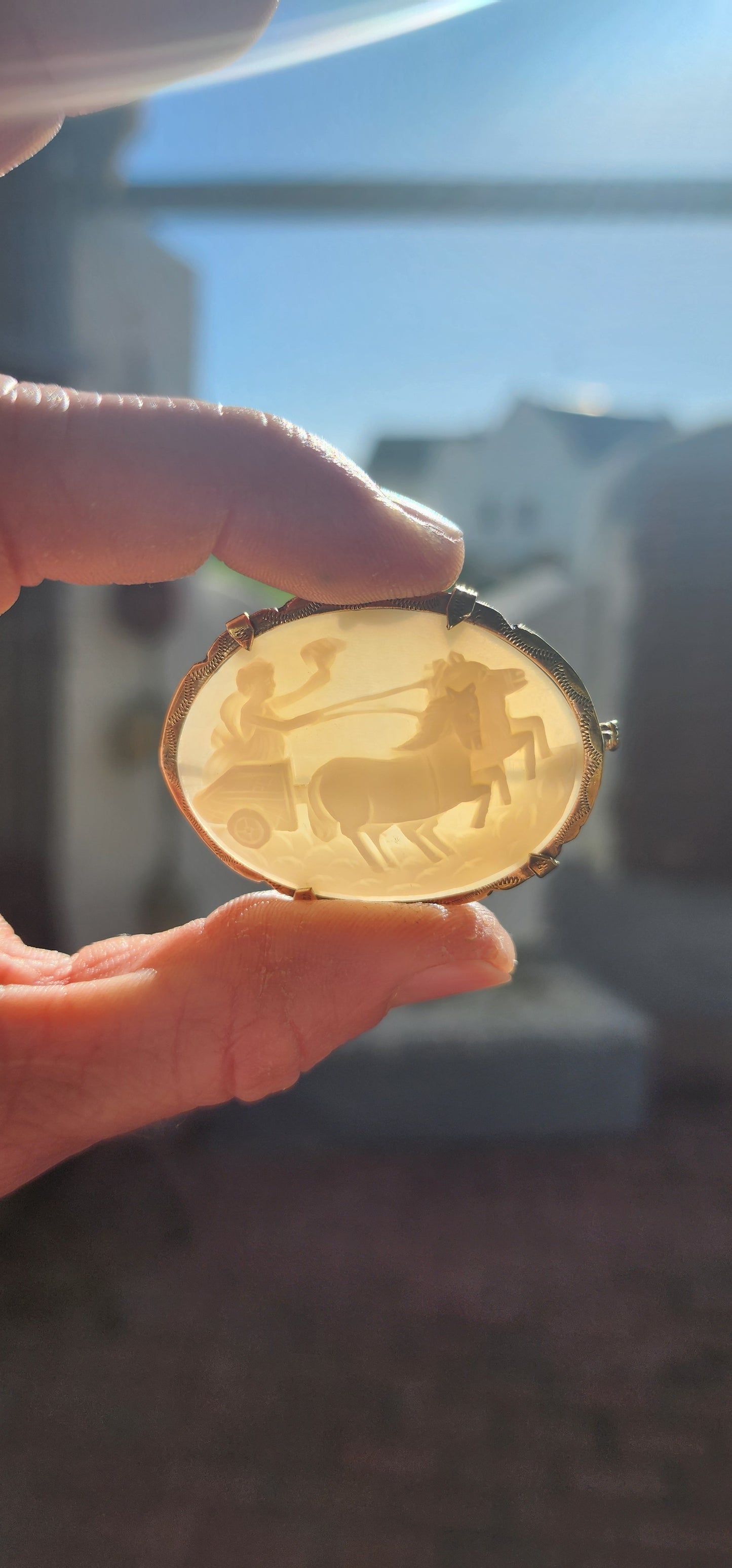 This is a generous-sized, antique late Victorian-era brooch, exquisitely crafted in warm-toned pinchbeck, a popular 19th-century alloy designed to resemble gold. Its mount cradles a beautifully hand-carved oval shell cameo.