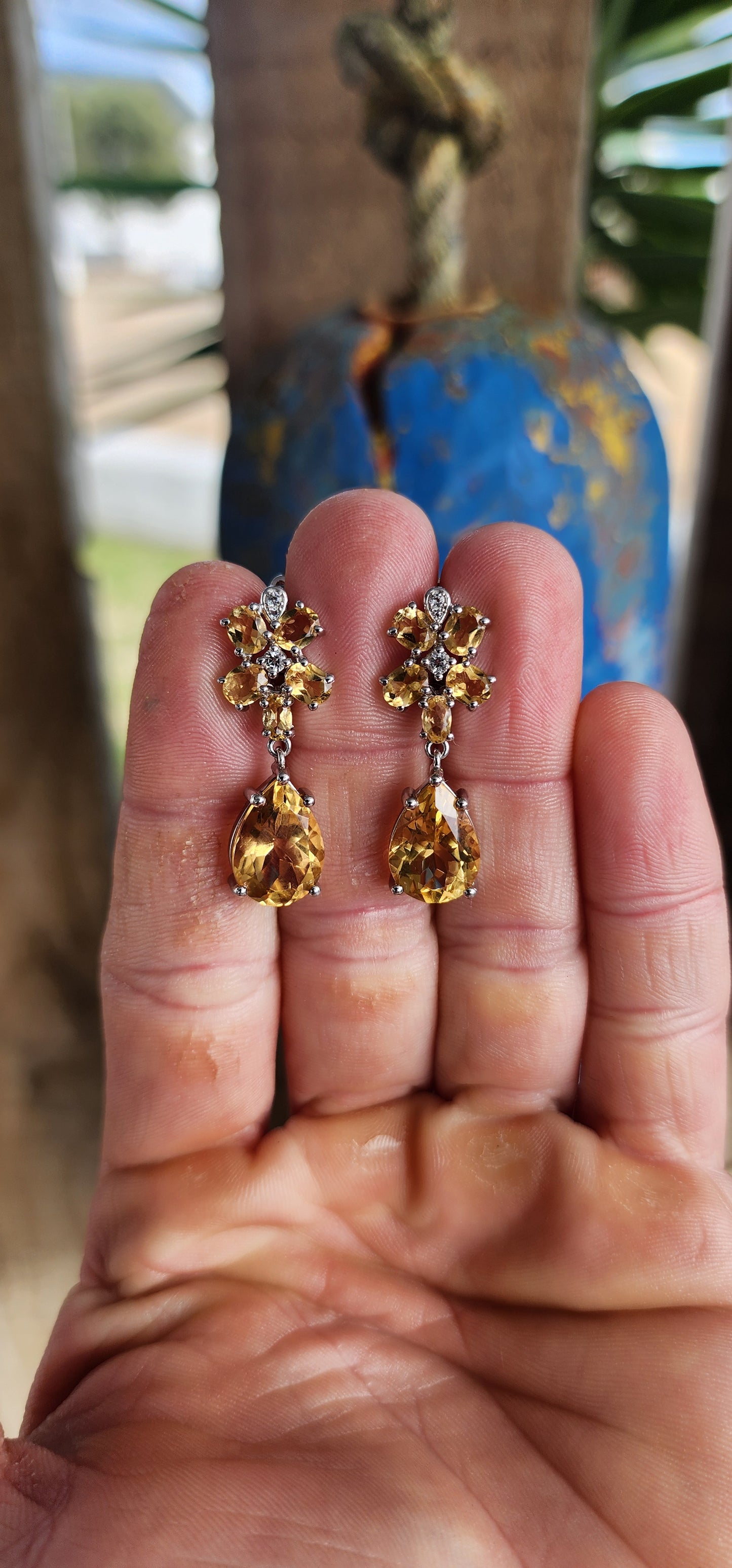 These elegant sterling silver drop earrings are a luminous tribute to nature’s golden glow, with a design inspired by delicate orchid blossoms.